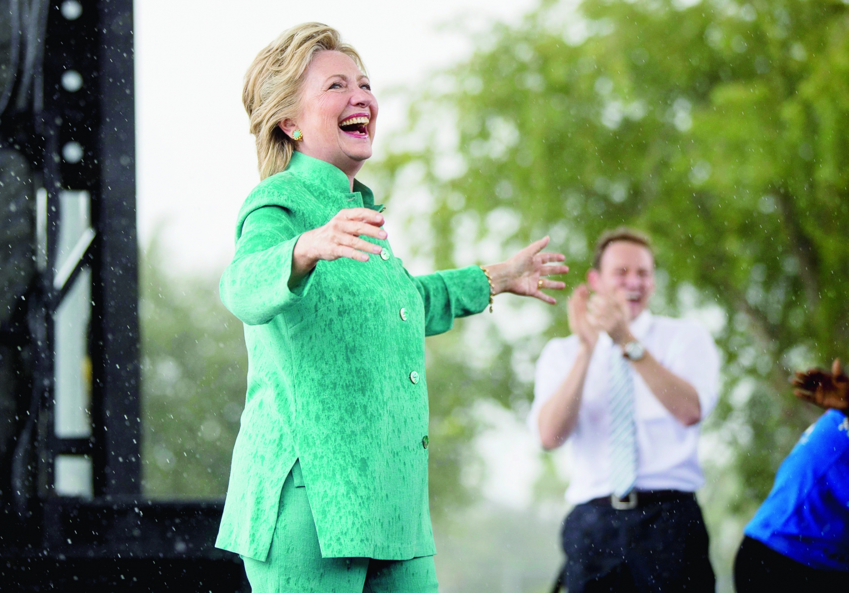 Democratic presidential candidate Hillary Clinton smiles as she cuts her speech short due to rain at a rally at C.B. Smith Park in Pembroke Pines, Fla., Saturday, Nov. 5, 2016. (AP Photo/Andrew Harnik) Campaign 2016 Clinton