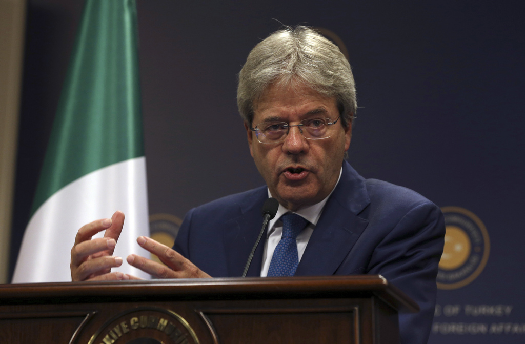 FILE - In this Thursday, Oct. 6, 2016 file photo, Italian Foreign Minister Paolo Gentiloni talks during a joint press conference with Turkish foreign Minister Mevlut Cavusoglu, in Ankara. Italy's Foreign Minister Paolo Gentiloni has been summoned to the presidential palace to see the president Sunday, Dec. 11, 2016, who could ask him to be premier and try to form a government. (AP Photo/Burhan Ozbilici, File)
