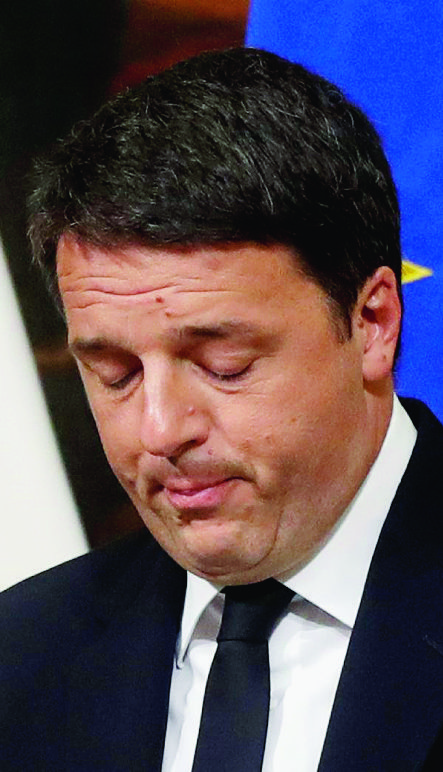 Italian Premier Matteo Renzi speaks during a press conference at the premier's office Chigi Palace in Rome, early Monday, Dec. 5, 2016. Renzi acknowledged defeat in a constitutional referendum and announced he will resign on Monday. Italians voted Sunday in a referendum on constitutional reforms that Premier Matteo Renzi has staked his political future on. (AP Photo/Gregorio Borgia) Italy Referendum