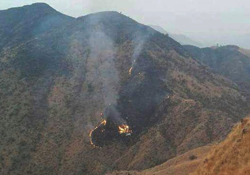 epa05663827 Flames rise from the wreckage of a Pakistan International Airlines (PIA) ATR 42 turboprop passenger plane after it crashed near Abbottabad,Pakistan, 07 December 2016. A  Pakistan International Airlines (PIA) ATR 42 plane with flight number PK-661 with more than 40 people on board has crashed in the north of the country. A spokesperson for the PIA said that an emergency response centre was activated and all resources possible were being mobilised to locate the aircraft. The PIA flight PK-661 was on its way from Chitral to Islamabad.  EPA/STRINGER BEST QUALITY AVAILABLE PAKISTAN AIRLINES PLANE CRASH