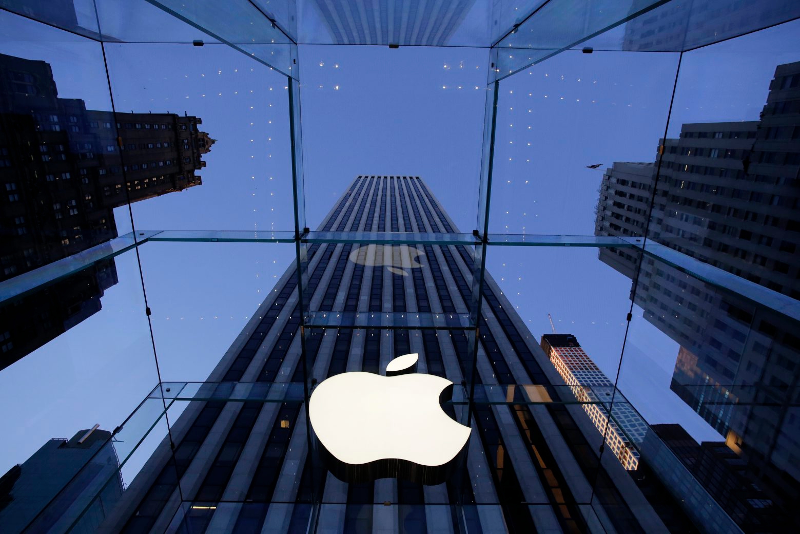 FILE - In this Sept. 5, 2014, file photo, the Apple logo hangs in the glass box entrance to the company's Fifth Avenue store in New York. Ireland is appealing the European Union's landmark order to collect 13 billion euros ( billion) in taxes from Apple. (AP Photo/Mark Lennihan, File) Ireland EU Apple