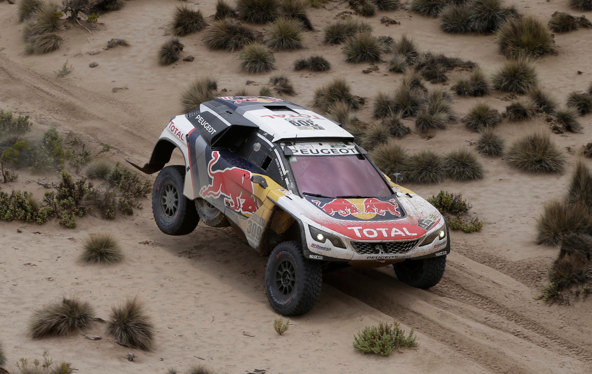 Driver Sebastien Loeb, of France, and co-driver Daniel Elena, of Monaco, race their Peugeot during the 7th stage of the Dakar Rally between Oruro and Uyuni, Bolivia, Monday, Jan. 9, 2017. The race started in Paraguay and passes through Argentina as well. (AP Photo/Martin Mejia) BOLIVIA DAKAR RALLY
