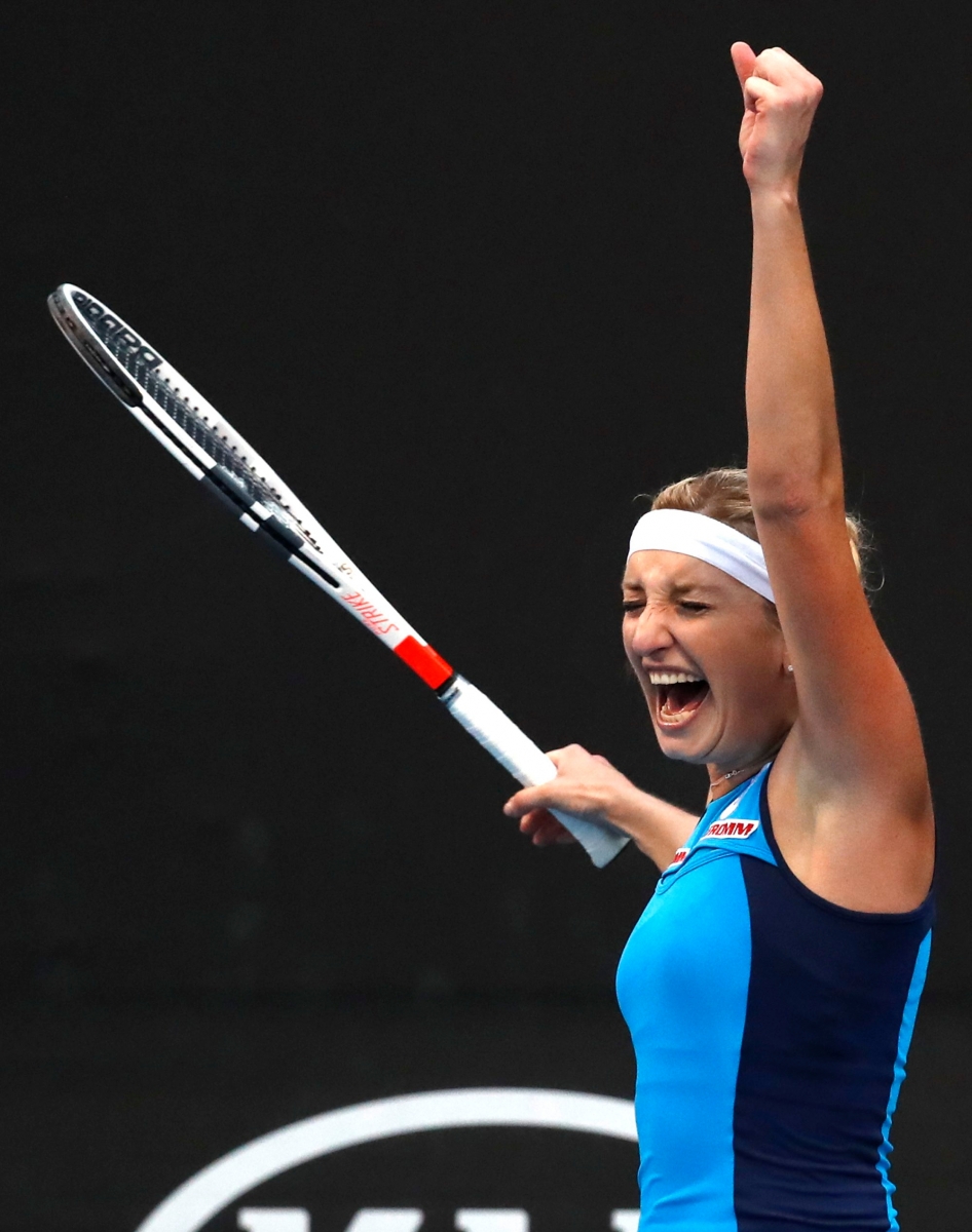 Switzerland's Timea Bacsinszky celebrates after defeating Italy's Camila Giorgi during their first round match at the Australian Open tennis championships in Melbourne, Australia, Tuesday, Jan. 17, 2017. (AP Photo/Kin Cheung) AUSTRALIAN OPEN TENNIS