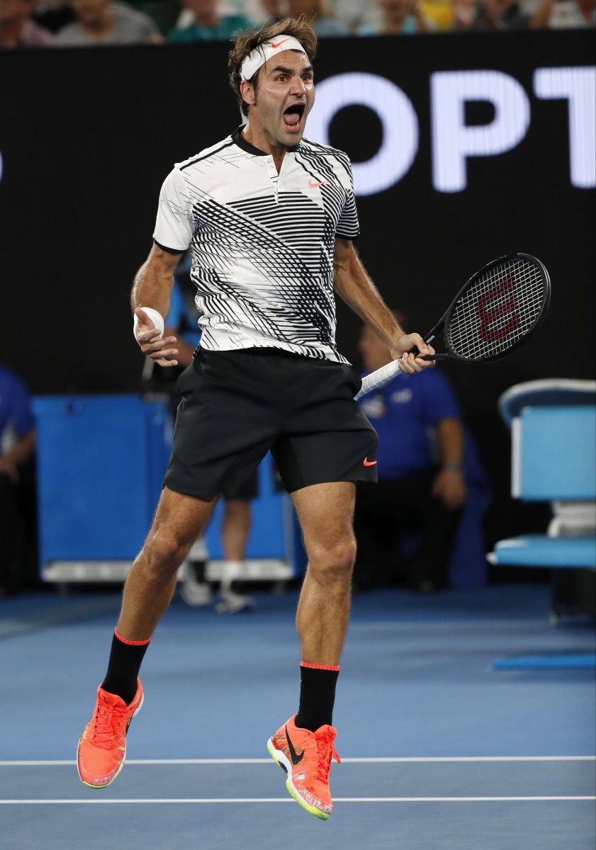 Switzerland's Roger Federer celebrates his win over Japan's Kei Nishikori during their fourth round match at the Australian Open tennis championships in Melbourne, Australia, Sunday, Jan. 22, 2017. (AP Photo/Dita Alangkara)
