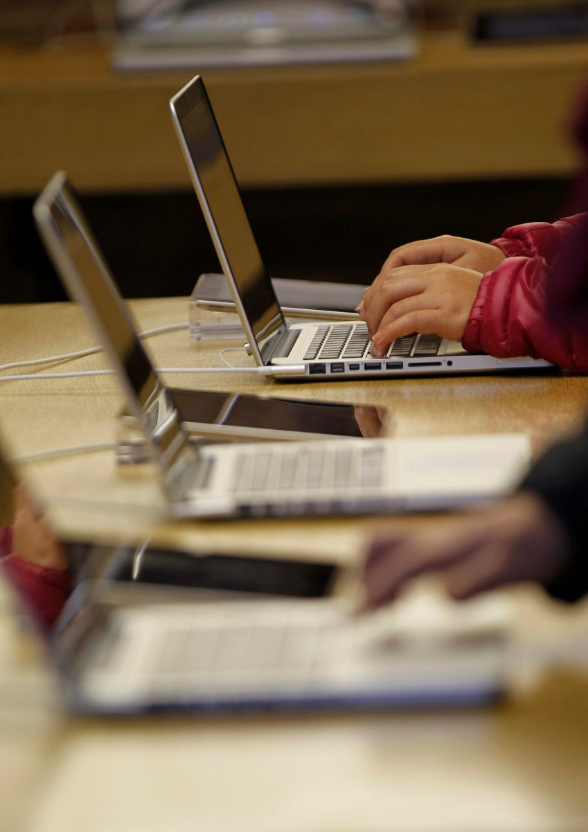 People use rge computers at a computer shop in central London, Wednesday, Nov. 14, 2012. UK Lawyers say the mounting tally of those arrested and convicted of making offensive comments through social media, shows the problems of a legal system trying to regulate 21st-century communications with 20th century laws. Civil libertarians say it is a threat to free speech in an age when the internet gives everyone the power to be heard around the world. (AP Photo/Sang Tan) Britain Freedom Of Tweets