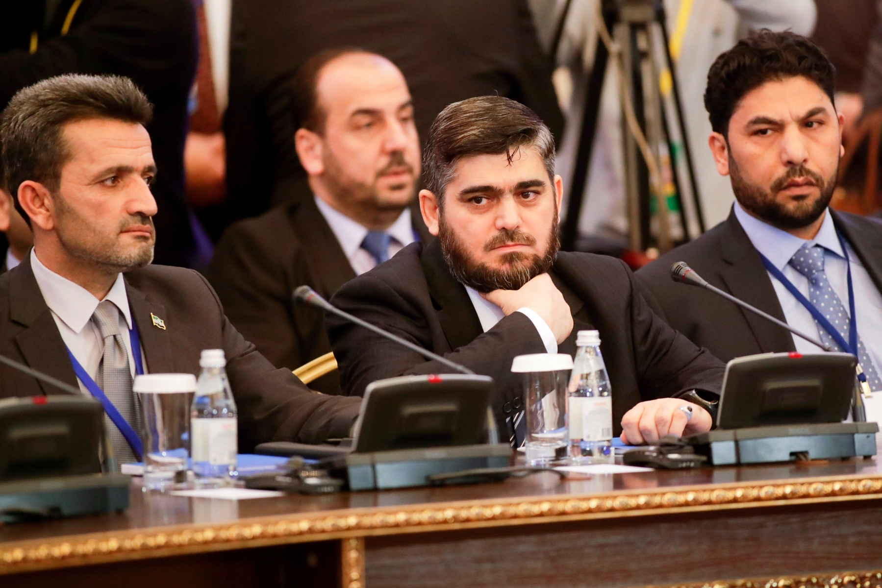 Mohammed Alloush, center, head of a Syrian opposition delegation, and other members attend talks on Syrian peace in Astana, Kazakhstan, Monday, Jan. 23, 2017. The talks are the latest attempt to forge a political settlement to end a war that has by most estimates killed more than 400,000 people since March 2011 and displaced more than half the country's population. (AP Photo/Sergei Grits) Kazakhstan Syria