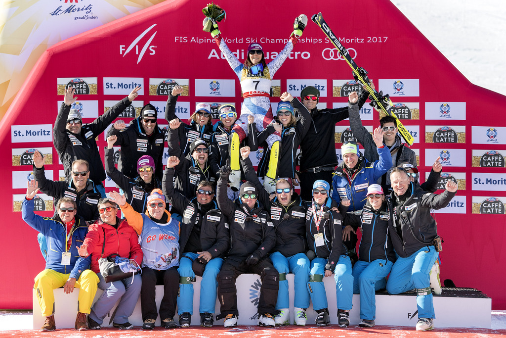 Silver medalist Wendy Holdener #7, of Switzerland, with Swiss team and her parents (sitting left) pose for the photographers on the podium, after the flower ceremony of the women Slalom at the 2017 FIS Alpine Skiing World Championships in St. Moritz, Switzerland, Saturday, February 18, 2017. (KEYSTONE/Peter Schneider)