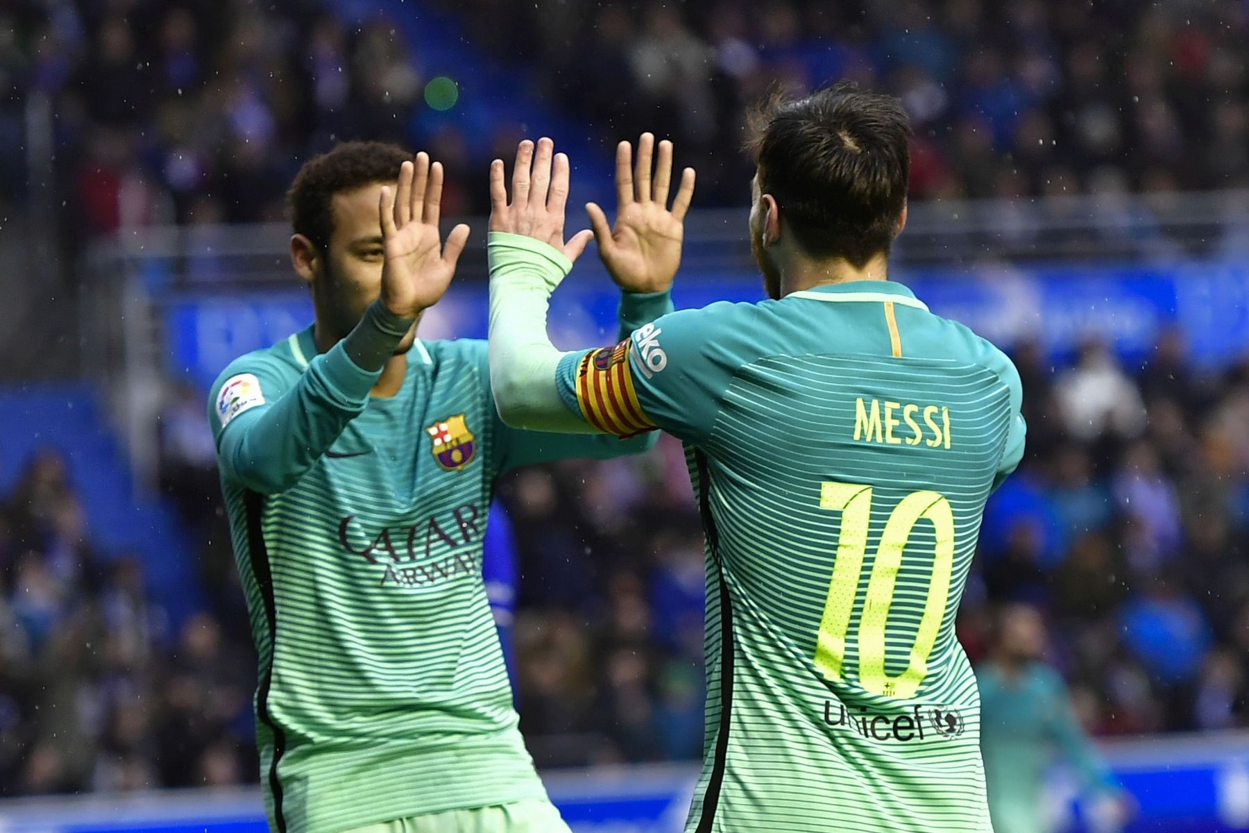 FC Barcelona's Neymar Jr. celebrates with his teammate Lionel Messi, after Messi scored during the Spanish La Liga soccer match between Barcelona and Deportivo Alaves, at Mendizorroza stadium, in Vitoria, northern Spain, Saturday, Feb.11, 2017. (AP Photo/Alvaro Barrient