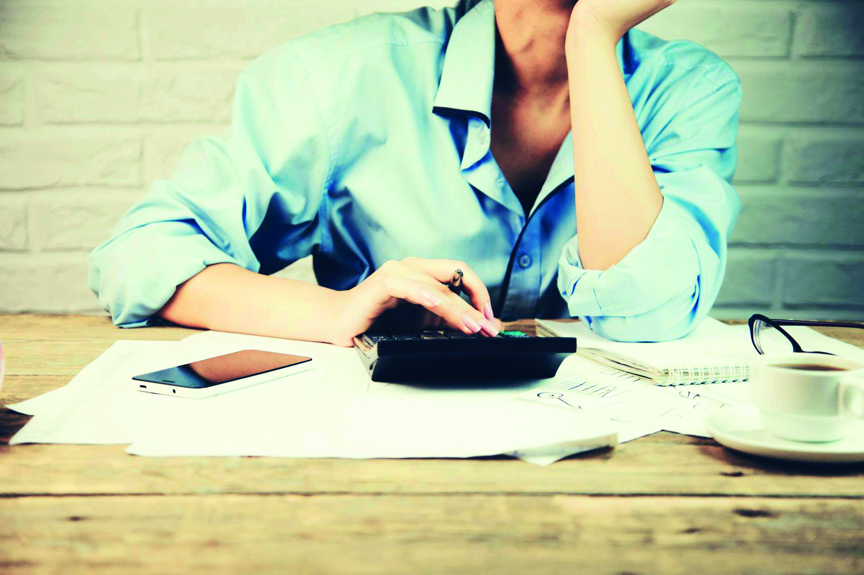 Close up of female accountant making calculations. Savings, finances and economy concept female accountant  making calculations