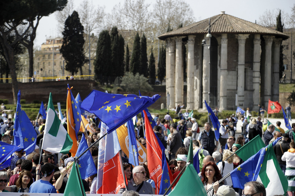 Demonstrators prepare to take part into a demonstration in support of the European Union in Rome, Saturday, March 25, 2017, the day leaders of the European Union gathered in Rome to mark the 60th anniversary of the bloc. In the background the so-called Temple of Vesta. (AP Photo/Gregorio Borgia)