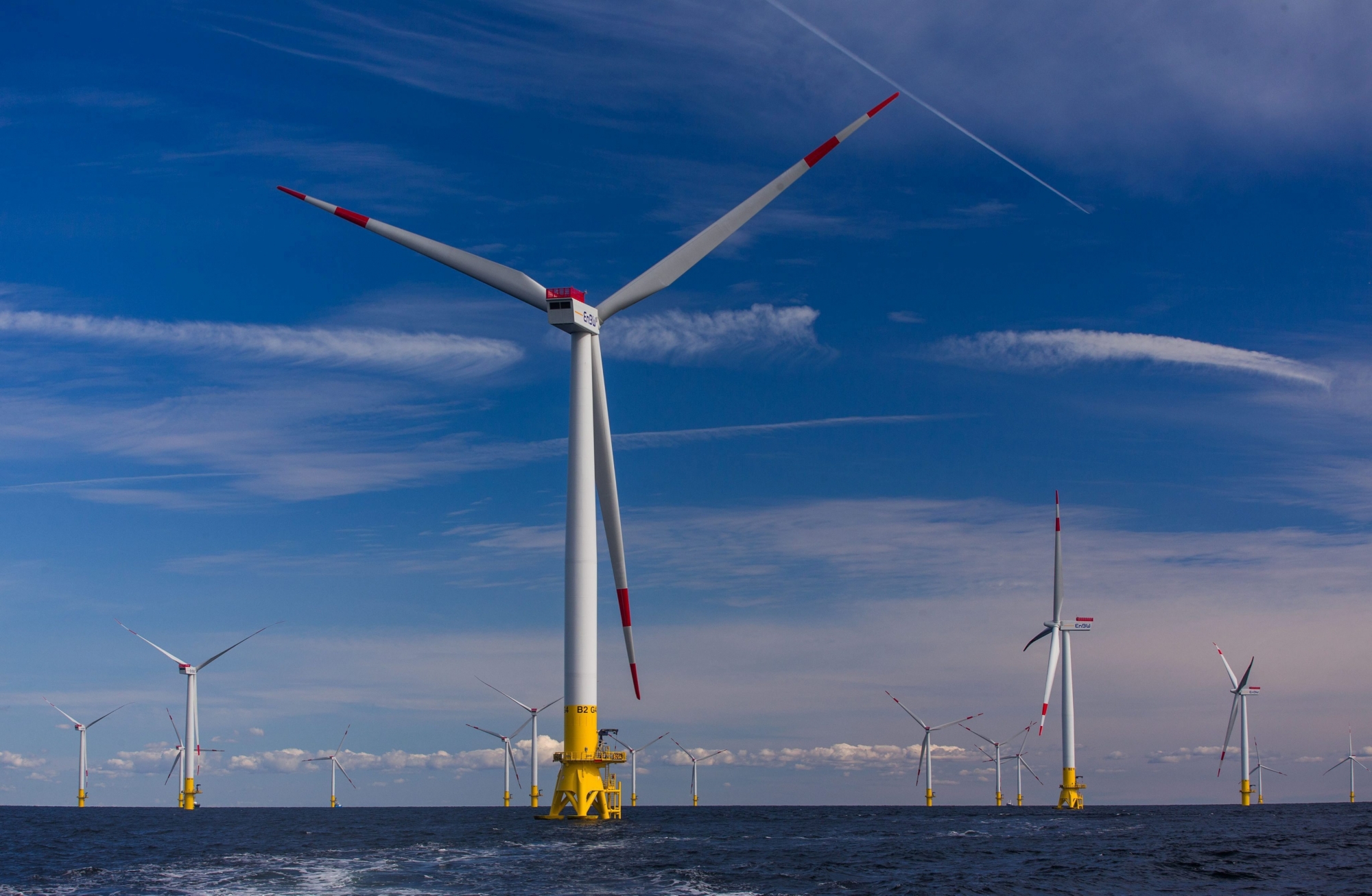 epa04932647 A picture made available 16 September 2015 shows the wind turbines of the offshore wind park 'Baltic 2', in the Baltic Sea close to the Island of Ruegen, Germany, 09 September 2015. The park was established by energy company 'EnBW' and will provide 340,000 households with energy. After a commissioning ceremony, the park will be brought online 21 September 2015.  EPA/JENS BUETTNER GERMANY ENERGY