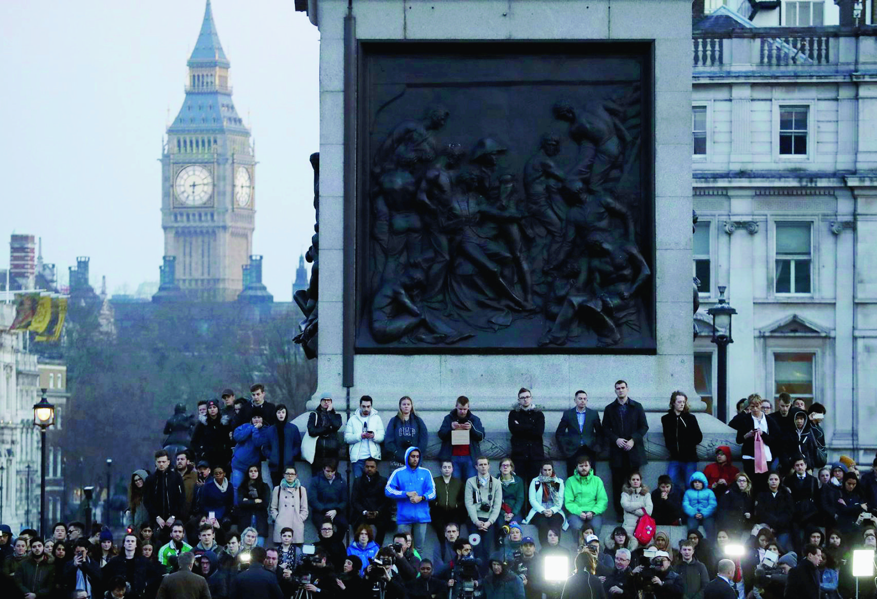 People observe a minutes silence at a vigil for the victims of Wednesday's attack, at Trafalgar Square in London, Thursday, March 23, 2017. The Islamic State group has claimed responsibility for an attack by a man who plowed an SUV into pedestrians and then stabbed a police officer to death on the grounds of Britain's Parliament. Mayor Sadiq Khan called for Londoners to attend a candlelit vigil at Trafalgar Square on Thursday evening in solidarity with the victims and their families and to show that London remains united. (AP Photo/Matt Dunham) Britain Attack