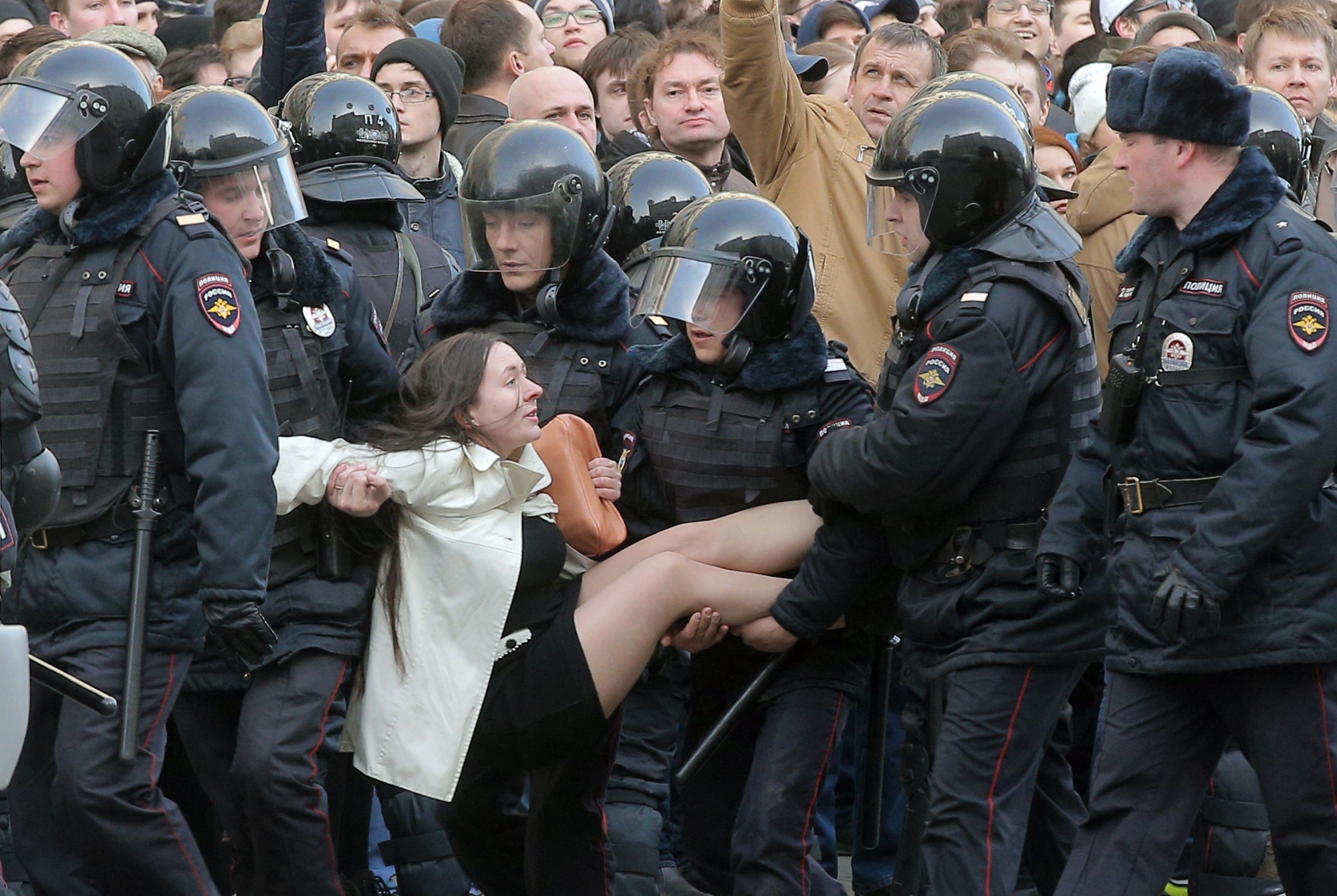 epaselect epa05871912 Russian riot policemen detain a demonstrator during an opposition rally in central Moscow, Russia, 26 March 2017. Russian opposition leader Alexei Navalny called on his supporters to join a demonstration in central Moscow despite a ban from Moscow authorities. Throughout Russia the opposition held the so-called anti-corruption rallies. According to reports, dozens of demonstrators have been detained across the country as they called for the resignation of Russian Prime Minister Dmitry Medvedev over corruption allegations.  EPA/MAXIM SHIPENKOV epaselect RUSSIA OPPOSITION RALLY