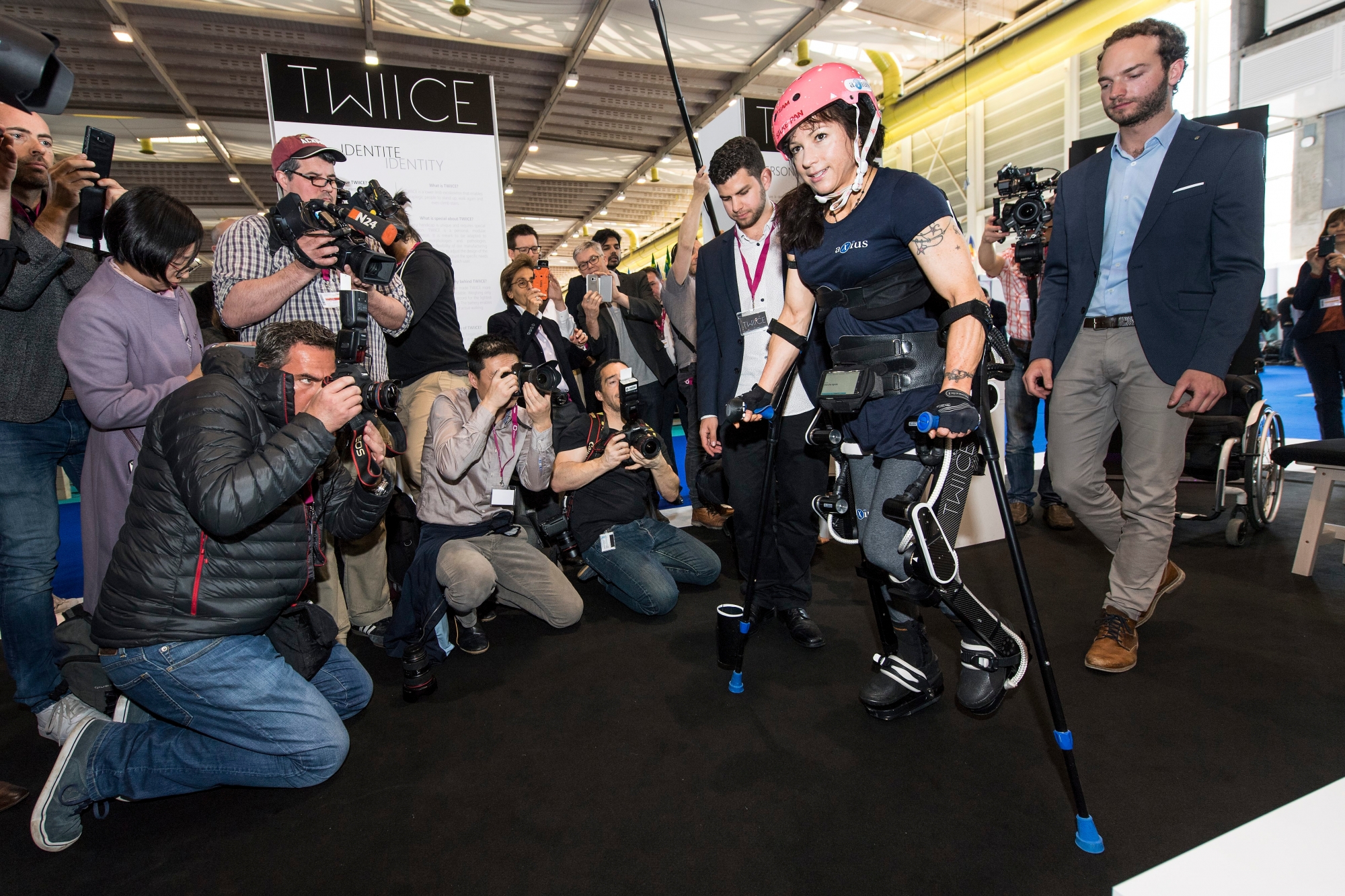 Silke Pan, a Handbike paraplegics athlete presents an invention called "Twiice", at the 45th International Exhibition of Inventions, in Geneva, Switzerland, Wednesday, March 29, 2017. Twiice is a lower limb exoskeleton that enables paraplegic people to stand up, walk again and even climb stairs. The development of a modular exoskeleton for walking assistance began in February 2015 at EPFL (Ecole polytechnique federale de Lausanne). (KEYSTONE/Jean-Christophe Bott) SWITZERLAND EXHIBITION OF INVENTIONS