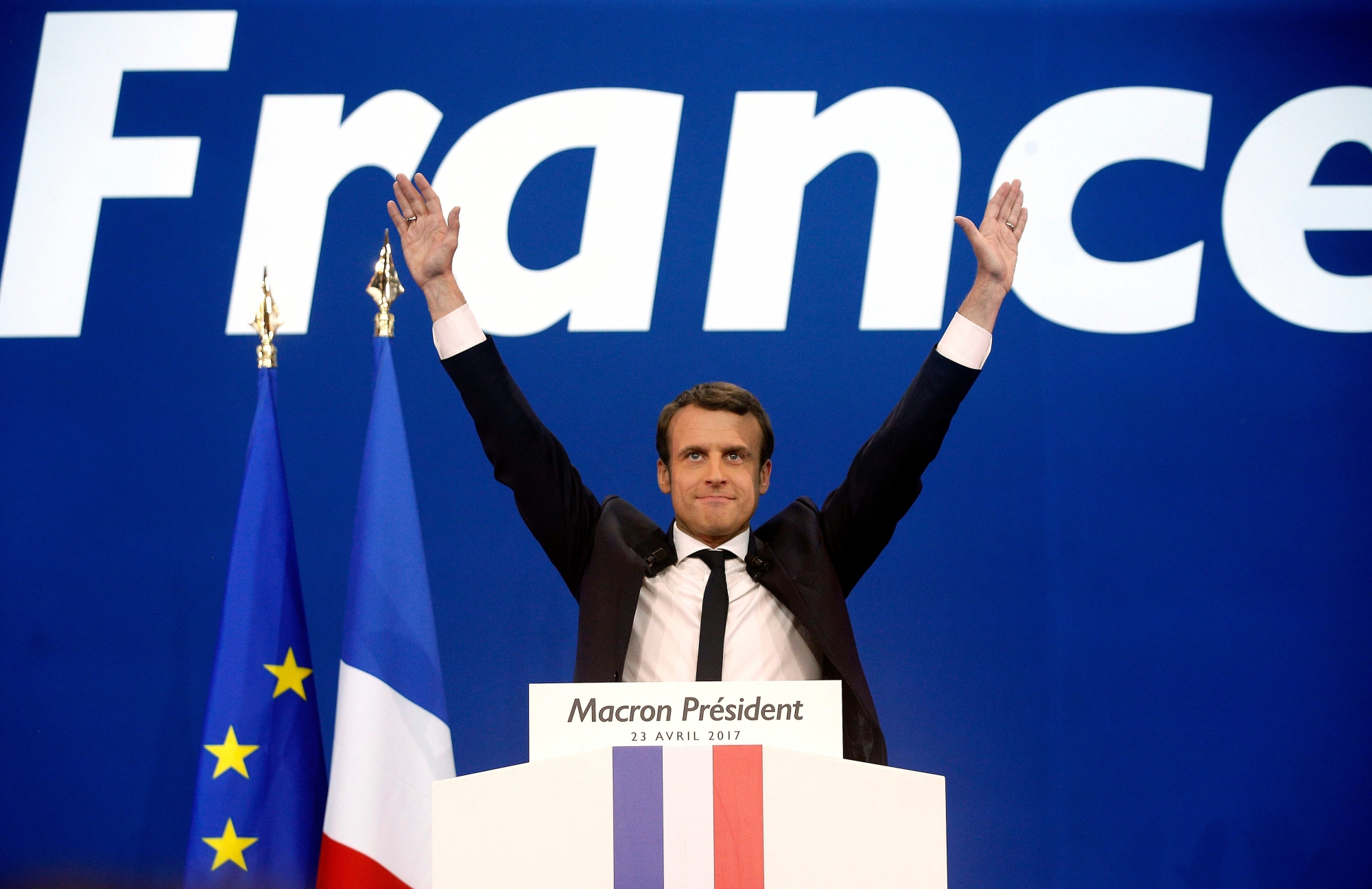 FILE - In this Sunday April 23, 2017 file photo, French centrist presidential candidate Emmanuel Macron waves before addressing his supporters at his election day headquarters in Paris. They could hardly be more different: Pro-European centrist Emmanuel Macron is facing anti-immigration, anti-EU Marine Le Pen in FranceÄôs presidential runoff May 7. (AP Photo/Thibault Camus, file) France Election Macron vs Le Pen