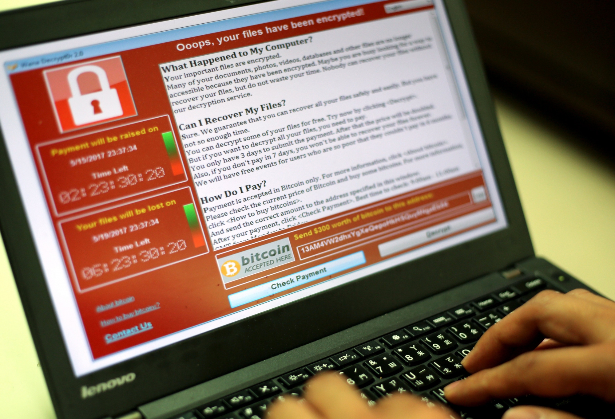 epa05960674 A programer shows a sample of a ransomware cyberattack on a laptop in Taipei, Taiwan, 13 May, 2017. According to news reports, a 'WannaCry' ransomware cyber attack hits thousands of computers in 99 countries encrypting files from affected computer units and demanding 300 US dollars through bitcoin to decrypt the files.  EPA/RITCHIE B. TONGO TAIWAN CYBER ATTACK