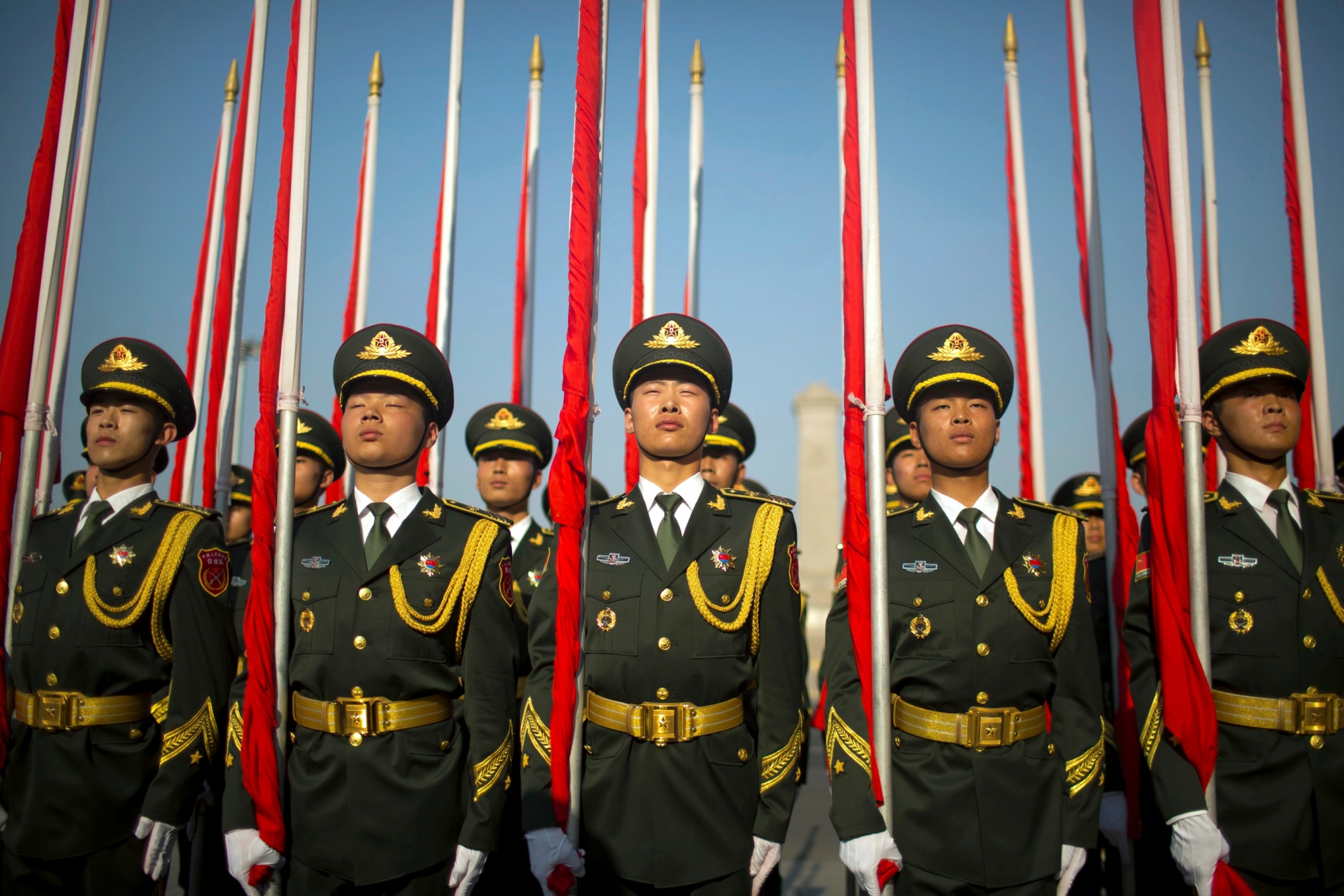 In this Wednesday, May 17, 2017, photo, members of the Chinese honor guard stand in formation before a welcome ceremony for Argentina's President Mauricio Macri at the Great Hall of the People in Beijing. (AP Photo/Mark Schiefelbein, File) The Week That Was In Asia Photo Gallery