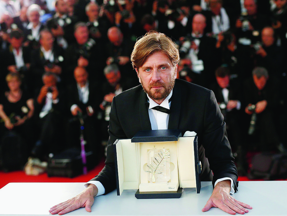 epa05996366 Swedish director Ruben Ostlund poses during the Award Winners photocall after he won the Palme d'Or (Golden Palm) Prize for 'The Square' at the 70th annual Cannes Film Festival in Cannes, France, 28 May 2017.  EPA/GUILLAUME HORCAJUELO FRANCE CANNES FILM FESTIVAL 2017