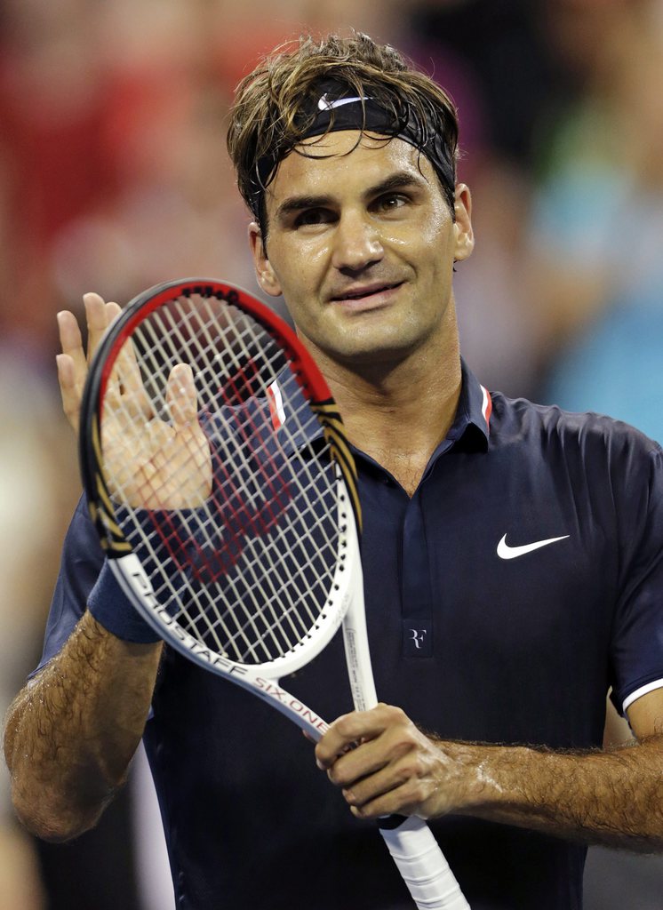Roger Federer, of Switzerland, acknowledges the crowd after defeating Donald Young 6-3, 6-2, 6-4 in the first round of play at the U.S. Open tennis tournament, Monday, Aug. 27, 2012, in New York. (AP Photo/Charles Krupa)