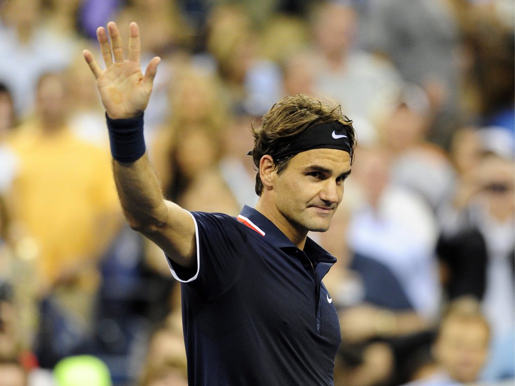 epa03376351 Roger Federer of Switzerland reacts after defeating Bjoern Phau of Germany during their match on the fourth day of the 2012 US Open Tennis Championship at the USTA National Tennis Center in Flushing Meadows, New York, USA, 30 August 2012. The US Open runs through  09 September 2012.  EPA/JASON SZENES