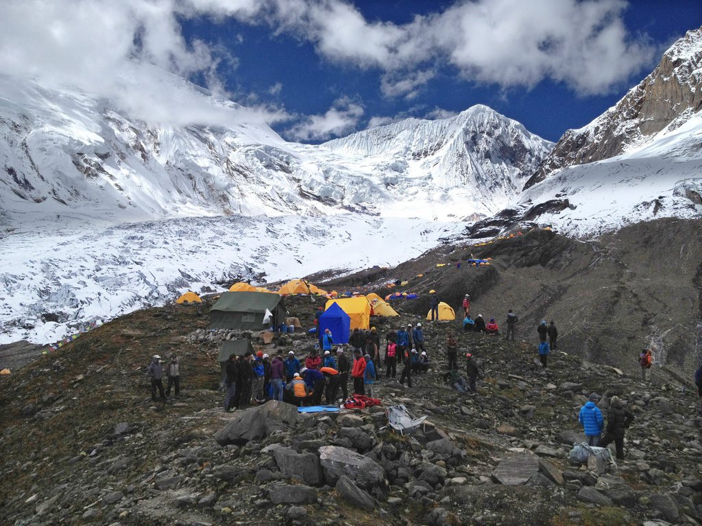 epa03407388 People gathered at the base camp of  8,156 meter hight Mount Manasalu after an avalanche struck killing more than seven people in Gorkha village, Kathmandu, Nepal, 23 September 2012. Reports state that seven bodies have been recovered and five others are missing in the avalanche at camp three on the 8,156 meter high Mount Manaslu.  EPA/SIMRIK AIR / HANDOUT HAND OUT/ SIMRIK AIR HANDOUT EDITORIAL USE ONLY/NO SALES