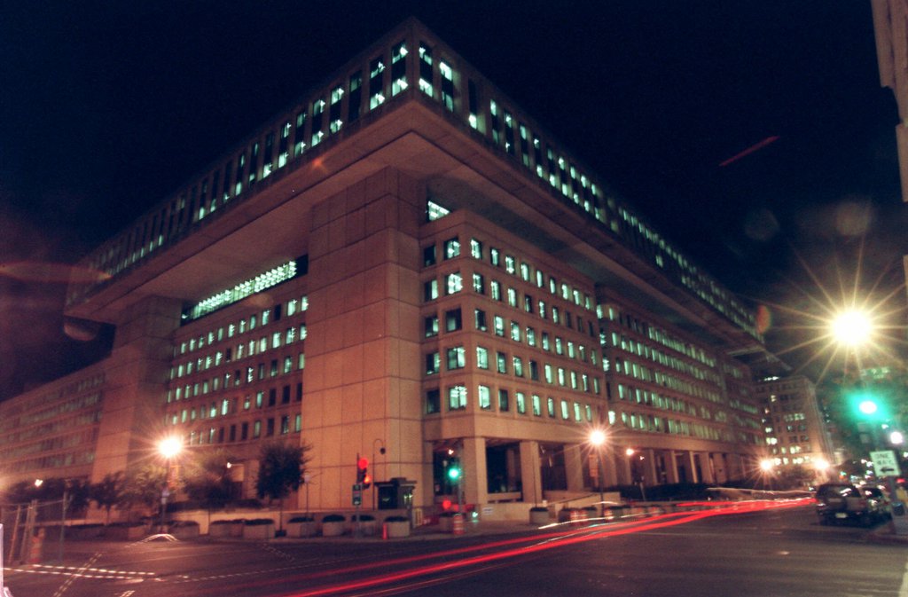 FILE - This Sept. 1, 1999, file photo, shows lights burning at FBI Headquarters in Washington. Invasion of privacy in the Internet age. Expanding the reach of law enforcement to snoop on e-mail traffic or on Web surfing. Those are among the criticisms being aimed at the FBI as it tries to update a key surveillance law. (AP Photo/Pablo Martinez Monsivais)