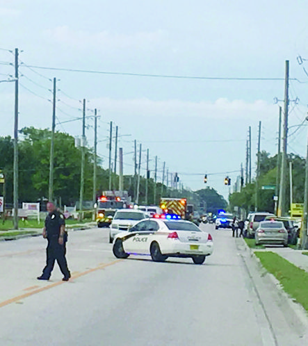 Police work near the scene of a shooting where they said there were multiple fatalities in an industrial area near Orlando, Fla., Monday, June 5, 2017. The Orange County Sheriff's Office said on its official Twitter account that the situation has been contained.  (Jacob Langston/Orlando Sentinel via AP) Florida Shooting