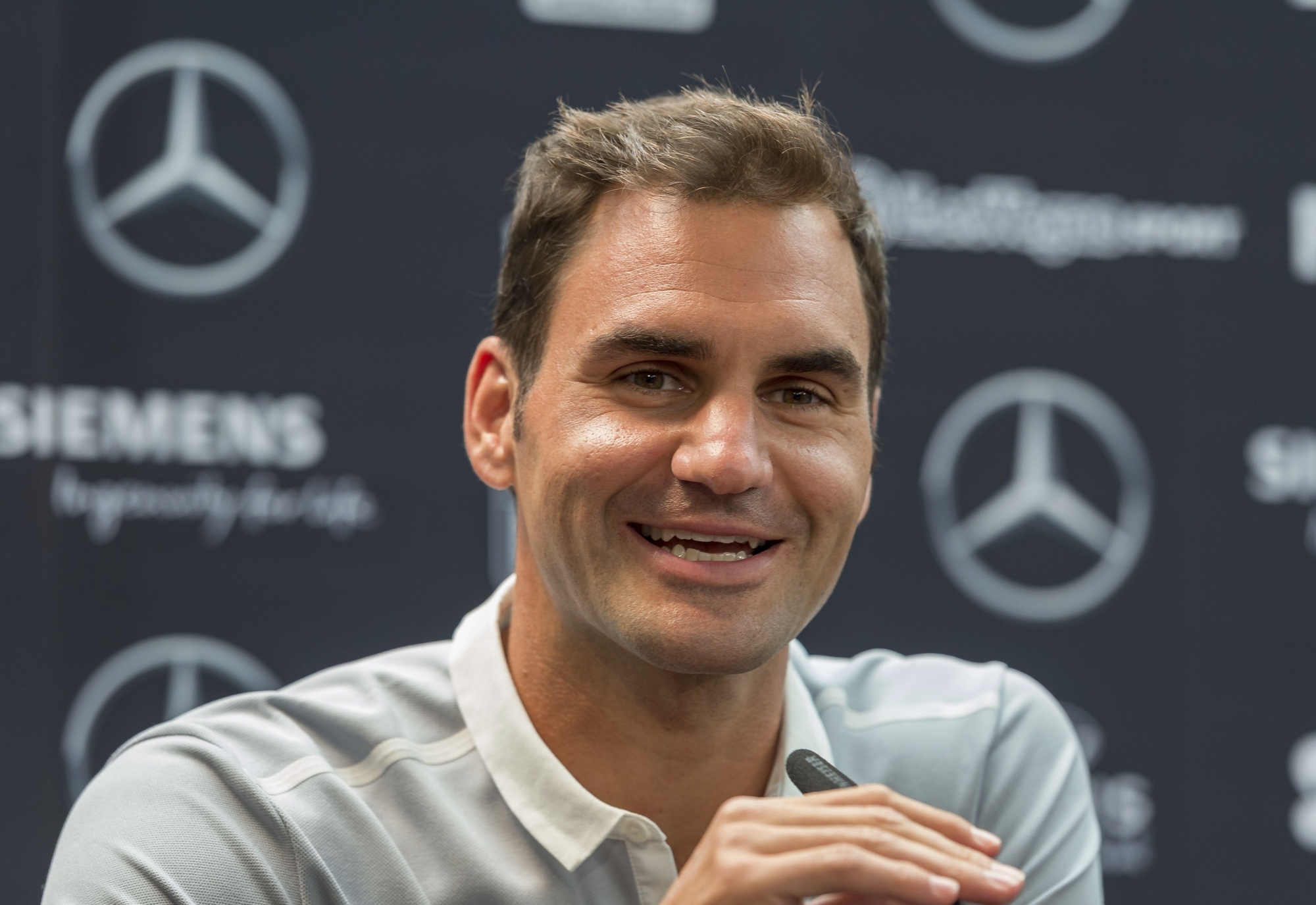 Professional tennis player Roger Federer from Switzerland speaks during a press conference at the ATP Mercedes Cup in Stuttgart, Germany, Monday, June 12, 2017. (Daniel Maurer/dpa via AP)