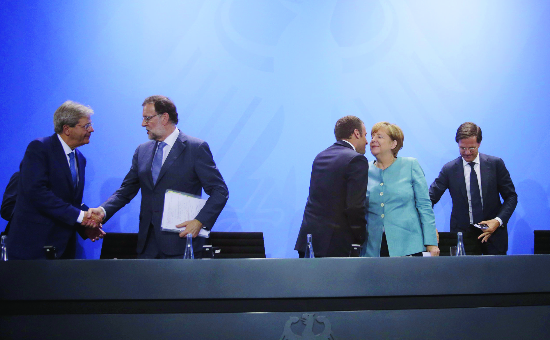 Italian Prime Minister Paolo Gentiloni, Spain's Prime Minister Mariano Rajoy, France's President Emmanuel Macron, German Chancellor Angela Merkel and Mark Rutte, Prime Minister of the Netherlands, from left, leave after a press conference after a gathering of European leaders on the upcoming G-20 summit in the chancellery in Berlin, Germany, Thursday, June 29, 2017. (AP Photo/Markus Schreiber) Germany G20