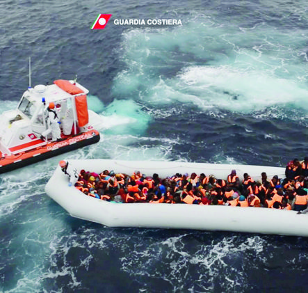 epa05663861 A handout picture dated 06 December 2016 and made available by the Italian Coast Guard on 07 December 2016 shows migrants on a boat during rescue operations in the Mediterranean Sea.  EPA/ITALIAN COAST GUARD / HANDOUT  HANDOUT EDITORIAL USE ONLY/NO SALES AT SEA MIGRATION RESCUE OPERATION