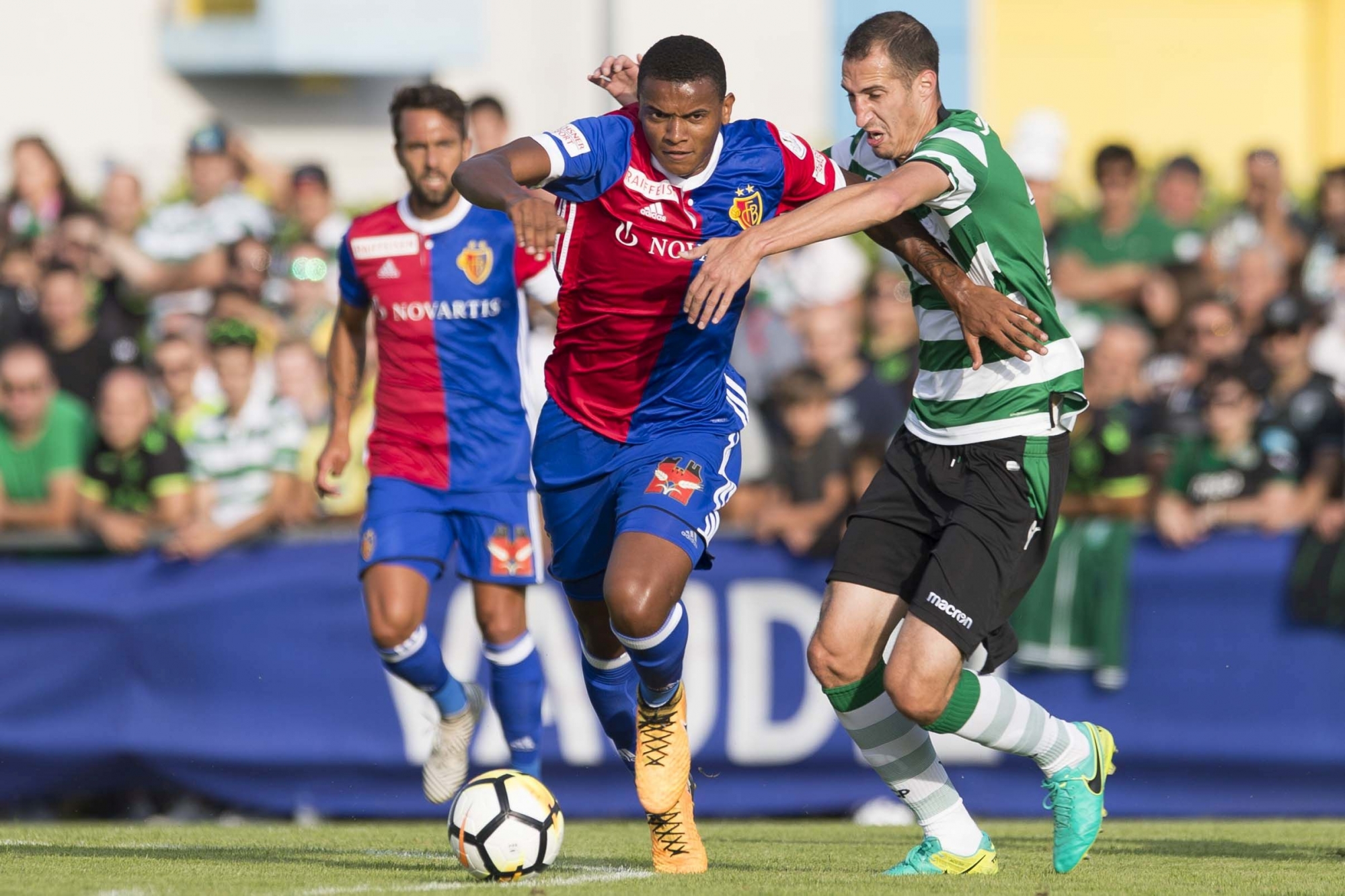 Basel's Manuel Akanji, left, fights for the ball with Sportingís Radosav Petrovic, right, during a friendly soccer match as part of the Festival de Football des Alpes between FC Basel of Switzerland and Sporting Clube of Portugal, at the Stadium of Greves, in Portalban, Switzerland, Saturday, July 15, 2017. (KEYSTONE/Thomas Delley).