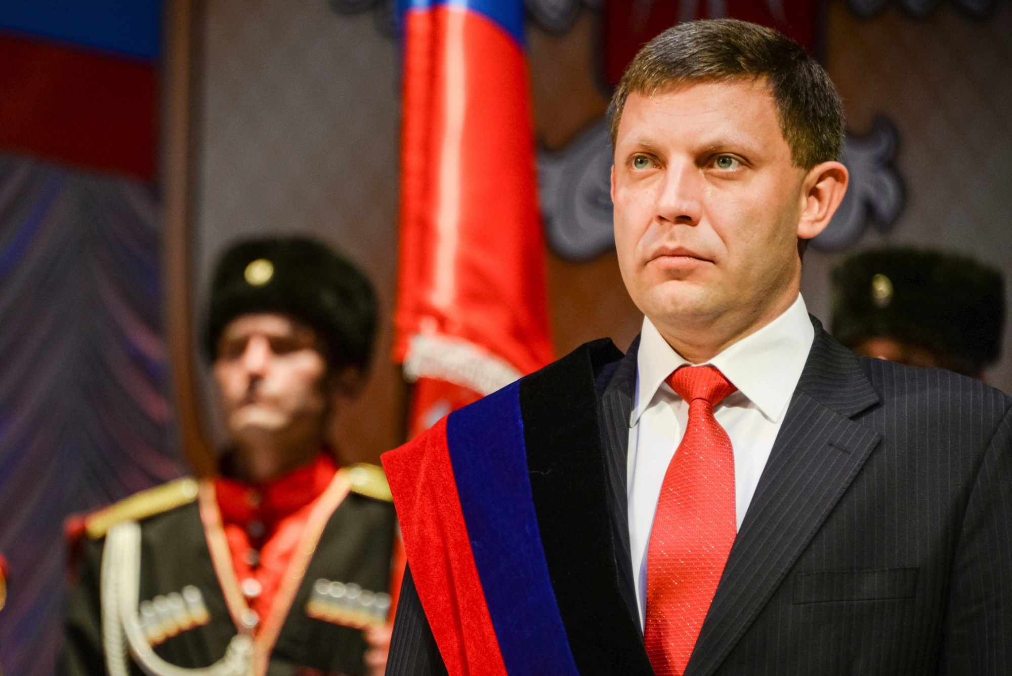 FILE - In this Tuesday, Nov. 4, 2014 file photo, rebel leader Alexander Zakharchenko stands during a swearing in ceremony in Donetsk, Ukraine. Separatists in eastern Ukraine on Tuesday, July 18, 2017 proclaimed a new state that aspires to include not only the areas they control but also the rest of the country. Donetsk separatist leader Alexander Zakharchenko said in comments broadcast on Russian television that rebels in Donetsk and Luhansk as well as representatives of other Ukrainian regions would form a state called Malorossiya. (AP Photo/Mstyslav Chernov, file) Ukraine