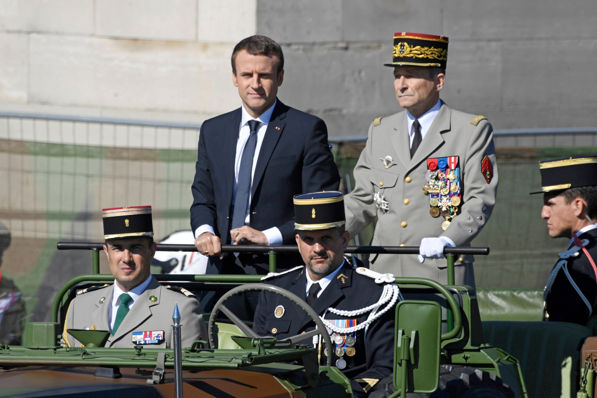 epa06095819 (FILE) - French President Emmanuel Macron (C) and Chief of the Defence Staff, French Army General Pierre de Villiers (R) arrive for the traditional military parade as part of the Bastille Day celebrations in Paris, France, 14 July 2017 (reissued 19 July 2017).  Defense Staff French Army General Pierre de Villiers gave in his resignation to French President Emmanuel Macron on 19 July 2017.  EPA/JULIEN DE ROSA (FILE) FRANCE MACRON DE VILLIERS