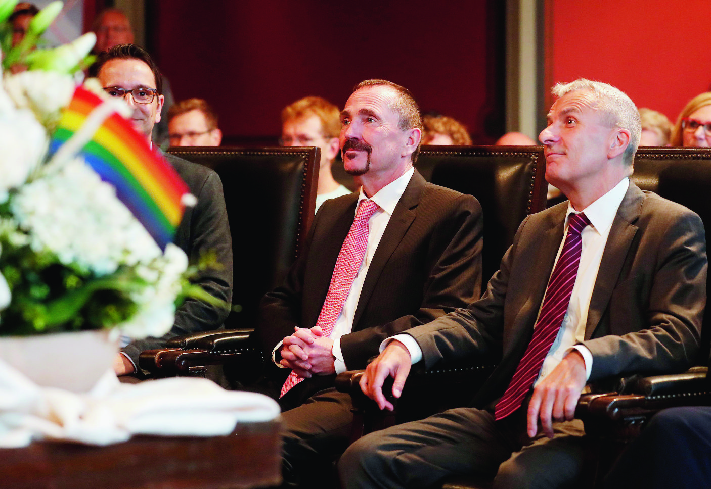 epa06237647 Karl Kreile (L) and Bodo Mende (R) listen to the registry officer during the first civil wedding ceremony between two men in Berlin, Germany, 01 October 2017. The same sex marriage law that was approved by the German Parliament in June becomes effective from the 01 October 2017. Till now gay and lesbian couples could only register partnerships, the same sex marriage law allow them to adopt children and equals their rights to those of heterosexual couples.  EPA/FELIPE TRUEBA GERMANY SAME SEX MARRIAGE