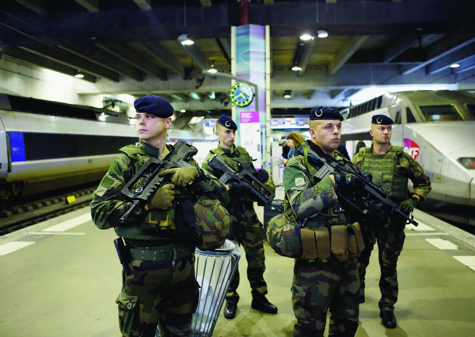 French soldiers stand guard at the Montparnasse railway station, in Paris, Monday, Oct. 2, 2017. (AP Photo/Thibault Camus) France Security