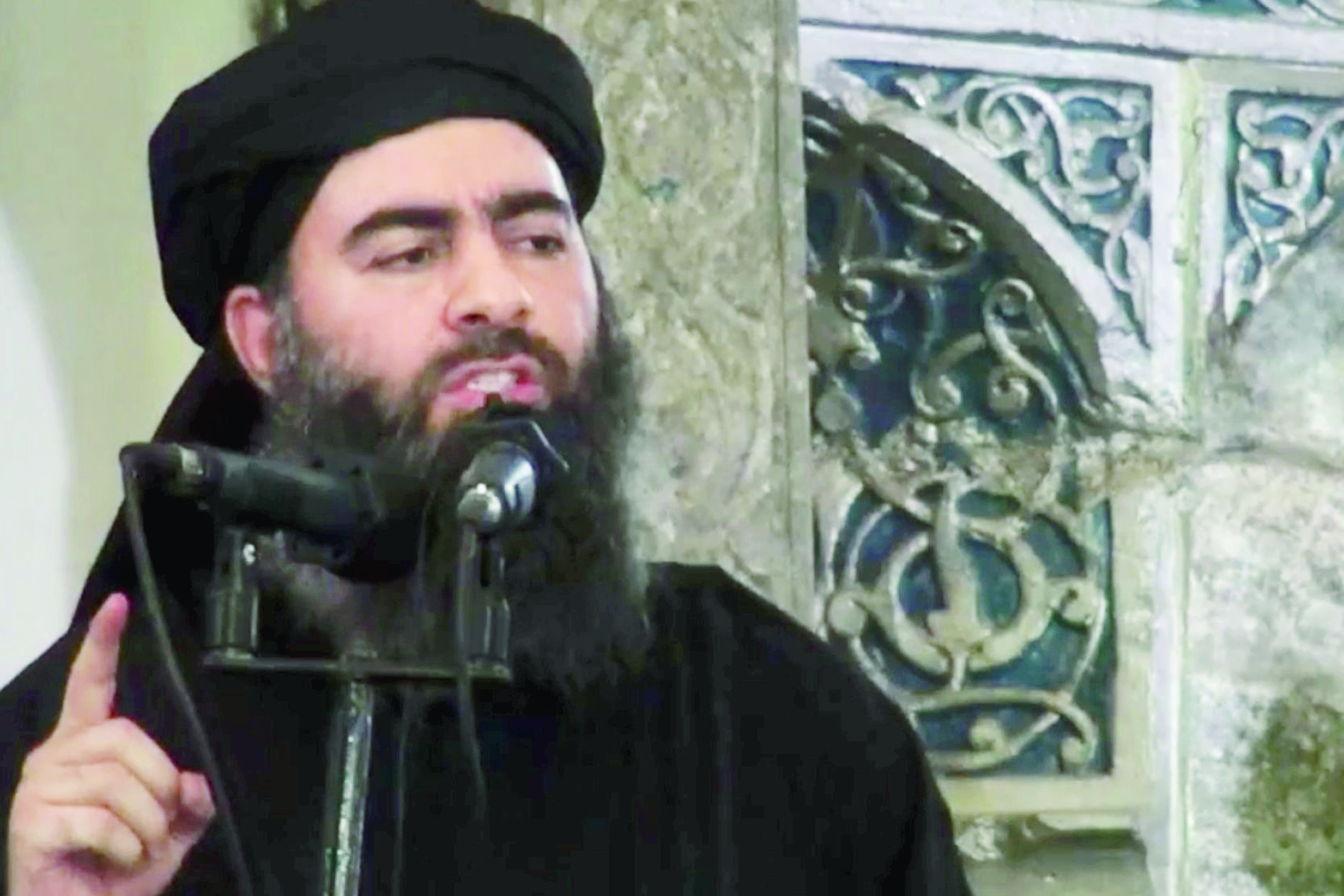FILE - This file image made from video posted on a militant website July 5, 2014, purports to show the leader of the Islamic State group, Abu Bakr al-Baghdadi, delivering a sermon at a mosque in Iraq during his first public appearance. Islamic State group leader Abu Bakr al-Baghdadi appears to be still alive, a top U.S. military commander said Thursday, Aug. 31, 2017, contradicting RussiaÄôs claims that it probably killed the top counterterror target months ago.(Militant video via AP, File) UNITED STATES ISLAMIC STATE