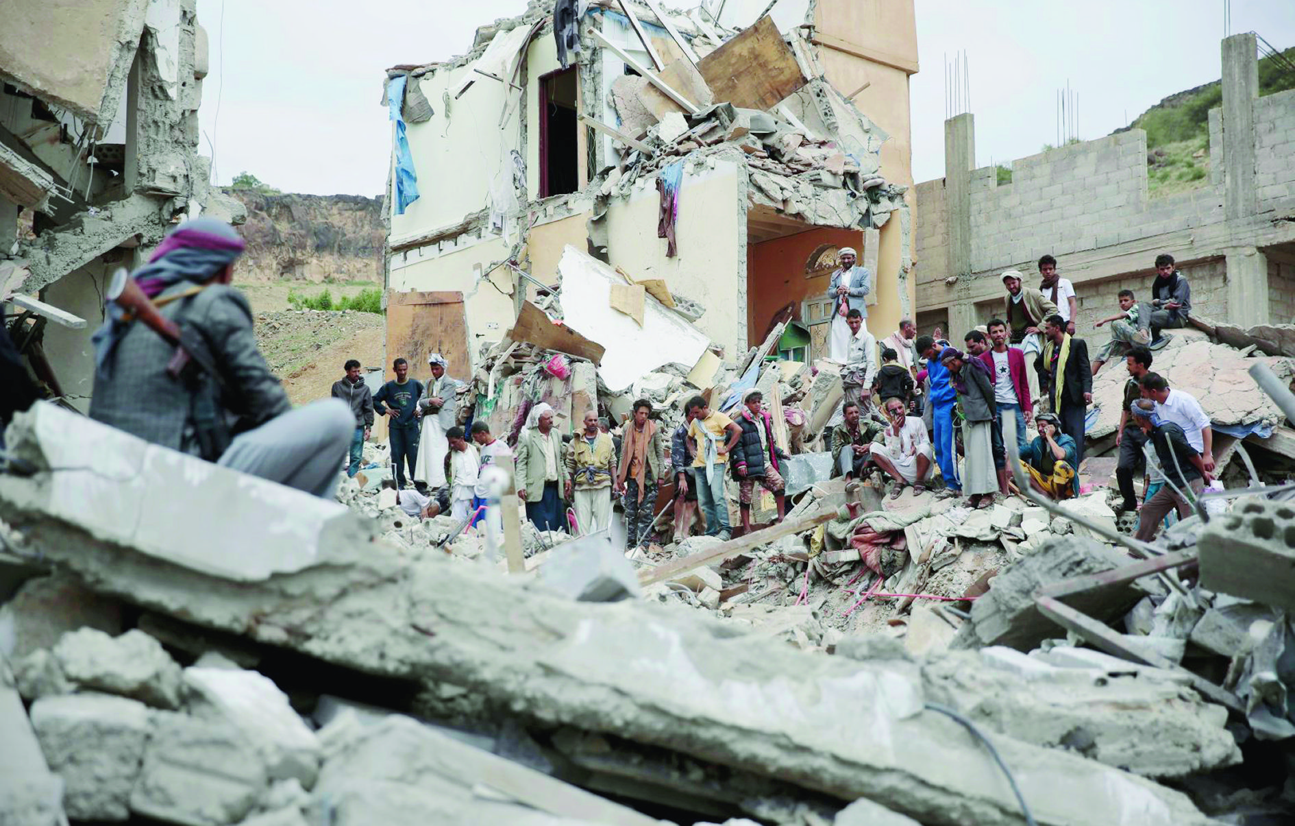 FILE - In this Aug. 25, 2017 file photo, People inspect the rubble of houses destroyed by Saudi-led airstrikes in Sanaa, Yemen. The Monday, Sept. 25, 2017, Kurdish independence referendum in Iraq is the latest in a series of¬moves toward formal secession or de facto fragmentation caused by conflict, race or religion in the Middle East. ItÄôs a trend viewed with considerable alarm in a region that had seriously flirted with merging its nations in post-colonial years more than a half century ago. (AP Photo/Hani Mohammed, File) Iraq Regional Breakups
