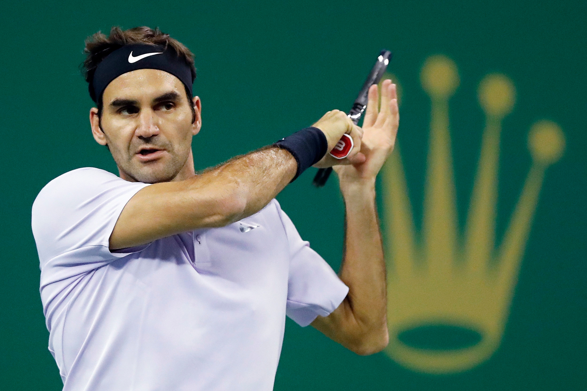 Roger Federer of Switzerland watches his shot as he plays against Diego Schwartzman of Argentina during their men's singles match in the Shanghai Masters tennis tournament at Qizhong Forest Sports City Tennis Center in Shanghai, China, Wednesday, Oct. 11, 2017. (AP Photo/Andy Wong) CHINA TENNIS SHANGHAI MASTERS