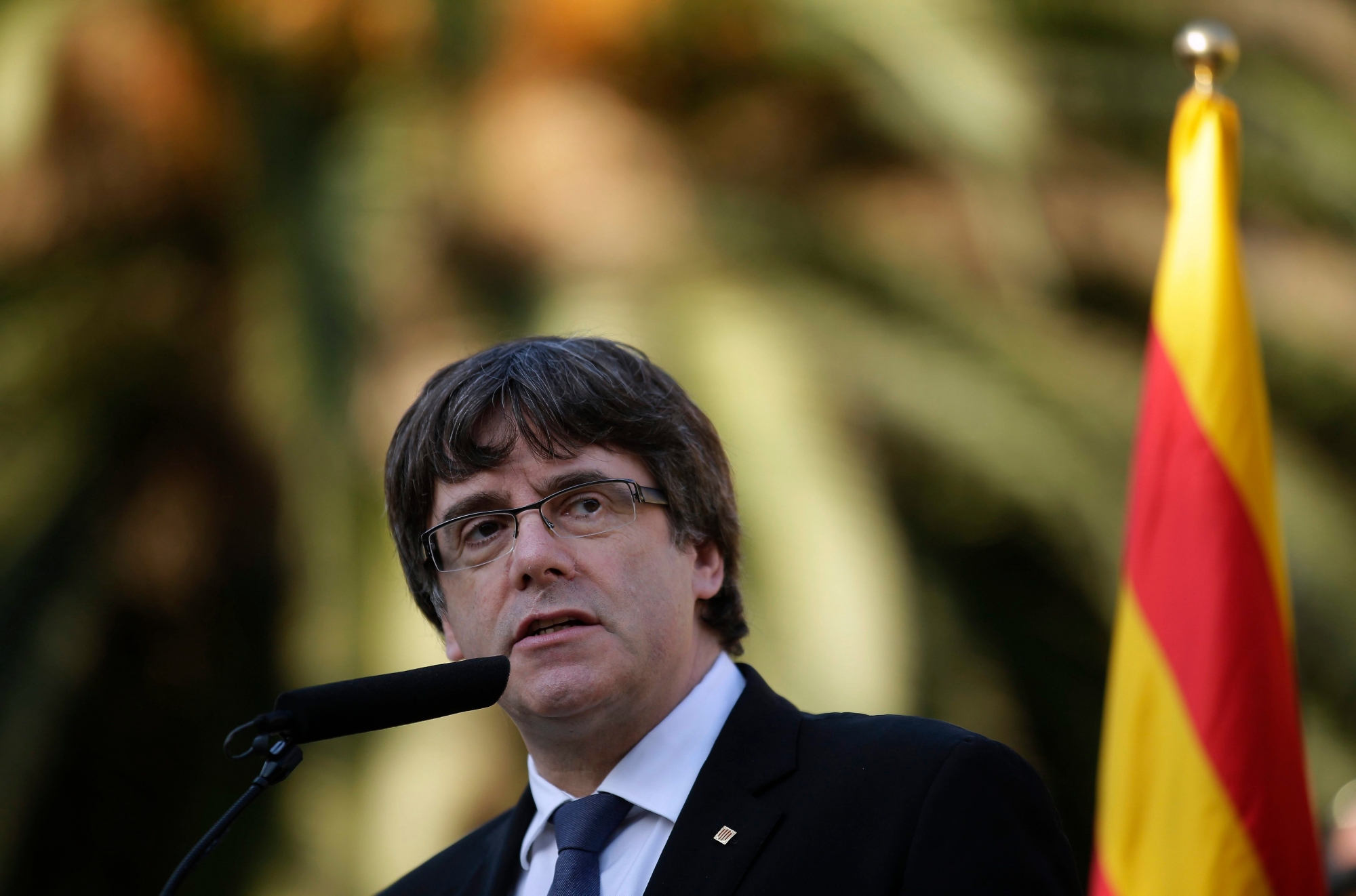 Catalan regional President Carles Puigdemont addresses to the media after a ceremony commemorating the 77th anniversary of the death of Catalan leader Lluis Companys at the Montjuic Cemetery in Barcelona, Spain, Sunday, Oct. 15, 2017. Catalonia's president is facing a critical decision that could determine the course of the region's secessionist movement to break away from Spain. The Spanish government has given Carles Puigdemont until Monday morning to clarify if he did or didn't actually declare independence earlier this week.(AP Photo/Manu Fernandez) Spain Catalonia