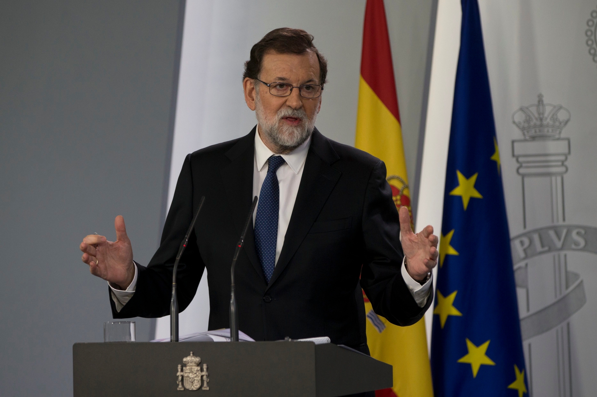 Spain's Prime Minister Mariano Rajoy speaks during a news conference at the Moncloa Palace in Madrid, Spain, Saturday, Oct. 21, 2017. The Spanish government moved to activate a previously untapped constitutional article Saturday so it can take control of Catalonia, illustrating its determination to derail the independence movement led by separatist politicians in the prosperous industrial region. (AP Photo/Paul White) Spain Catalonia