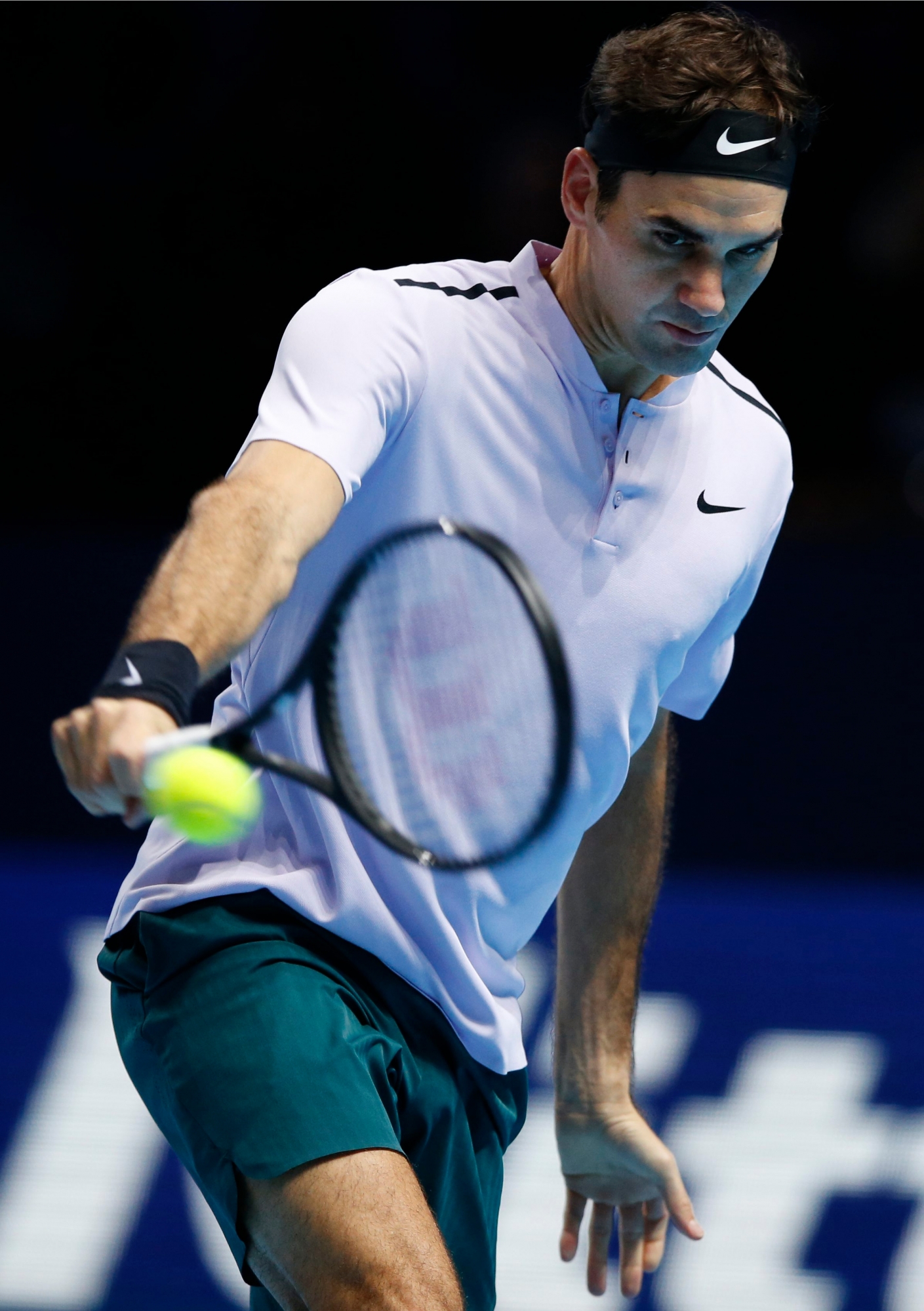 Roger Federer of Switzerland plays a return to Marin Cilic of Croatia during their mens singles match at the ATP World Finals at the O2 Arena in London, Thursday, Nov. 16, 2017. (AP Photo/Alastair Grant) BRITAIN TENNIS ATP FINALS