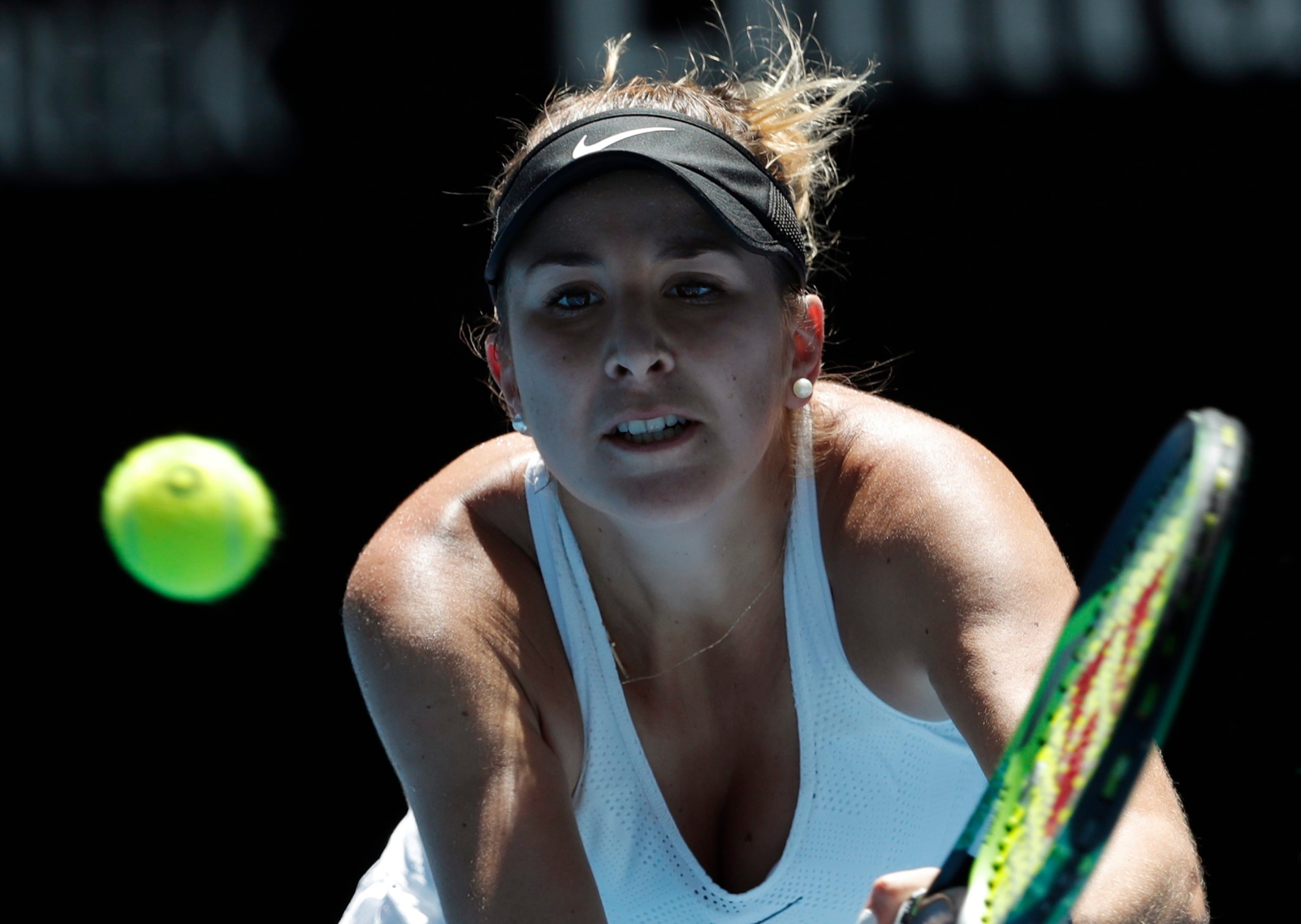 Switzerland's Belinda Bencic keeps eye on the ball for a backhand in a second round match against Thailand's Luksika Kumkhum at the Australian Open tennis championships in Melbourne, Australia, Wednesday, Jan. 17, 2018. (AP Photo/Vincent Thian) AUSTRALIAN OPEN TENNIS