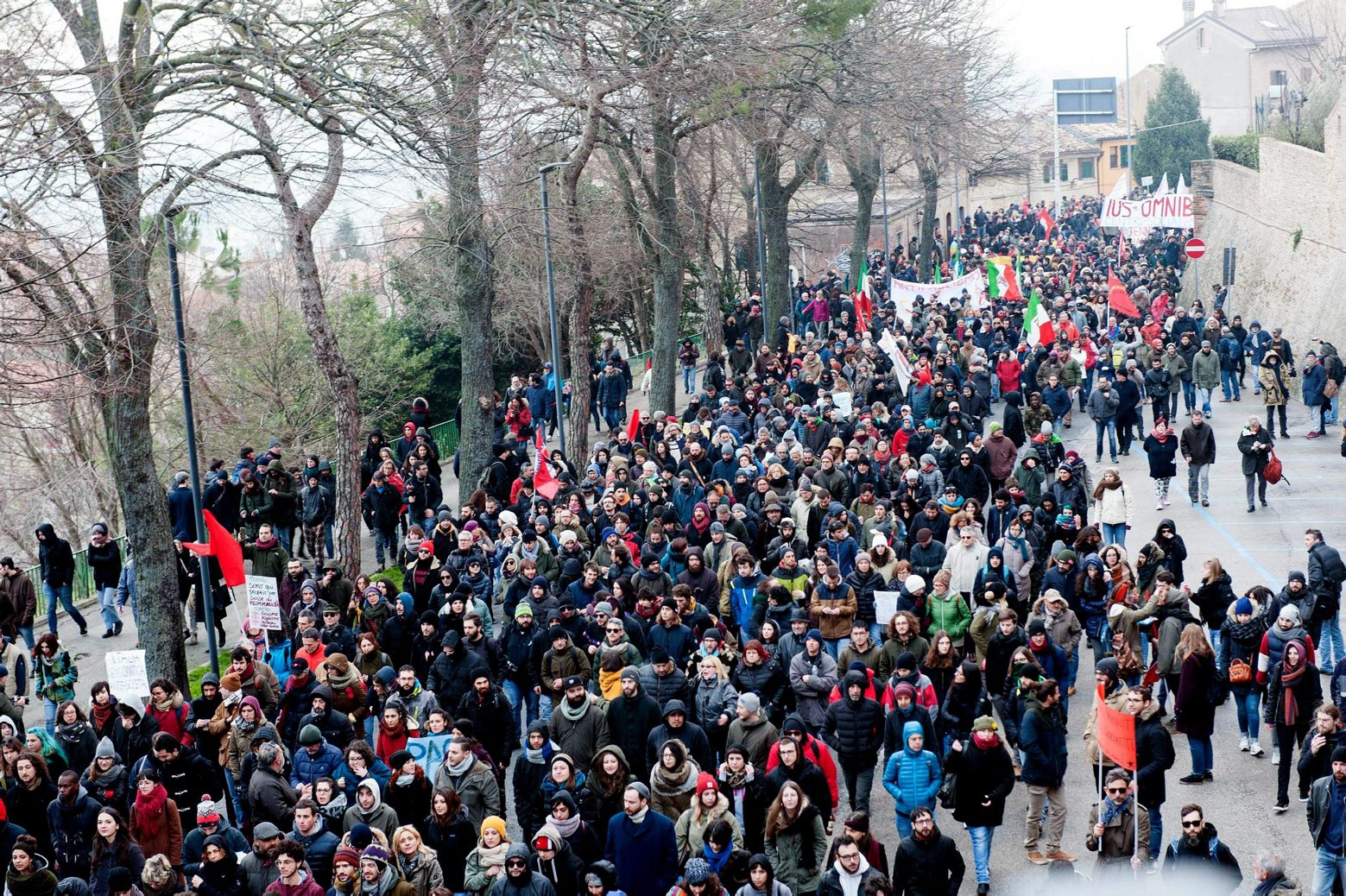 People take to the streets to partecipate in a anti-racism march following last SaturdayÄôs attacks in the Italian city of Macerata when six Africans were wounded in a two-hour drive-by shooting spree by a right-wing extremist, in Macerata, Italy, Saturday, Feb. 10, 2018. The Italian city where a man with a neo-Nazi background shot and wounded six Africans is bracing for the possibility of violence around an anti-fascist protest march. Schools in the city of Macerata were ordered closed on Saturday, while public transportation was halted for the afternoon protest. (Fabio Falcioni/ANSA via AP) Italy Shooting March
