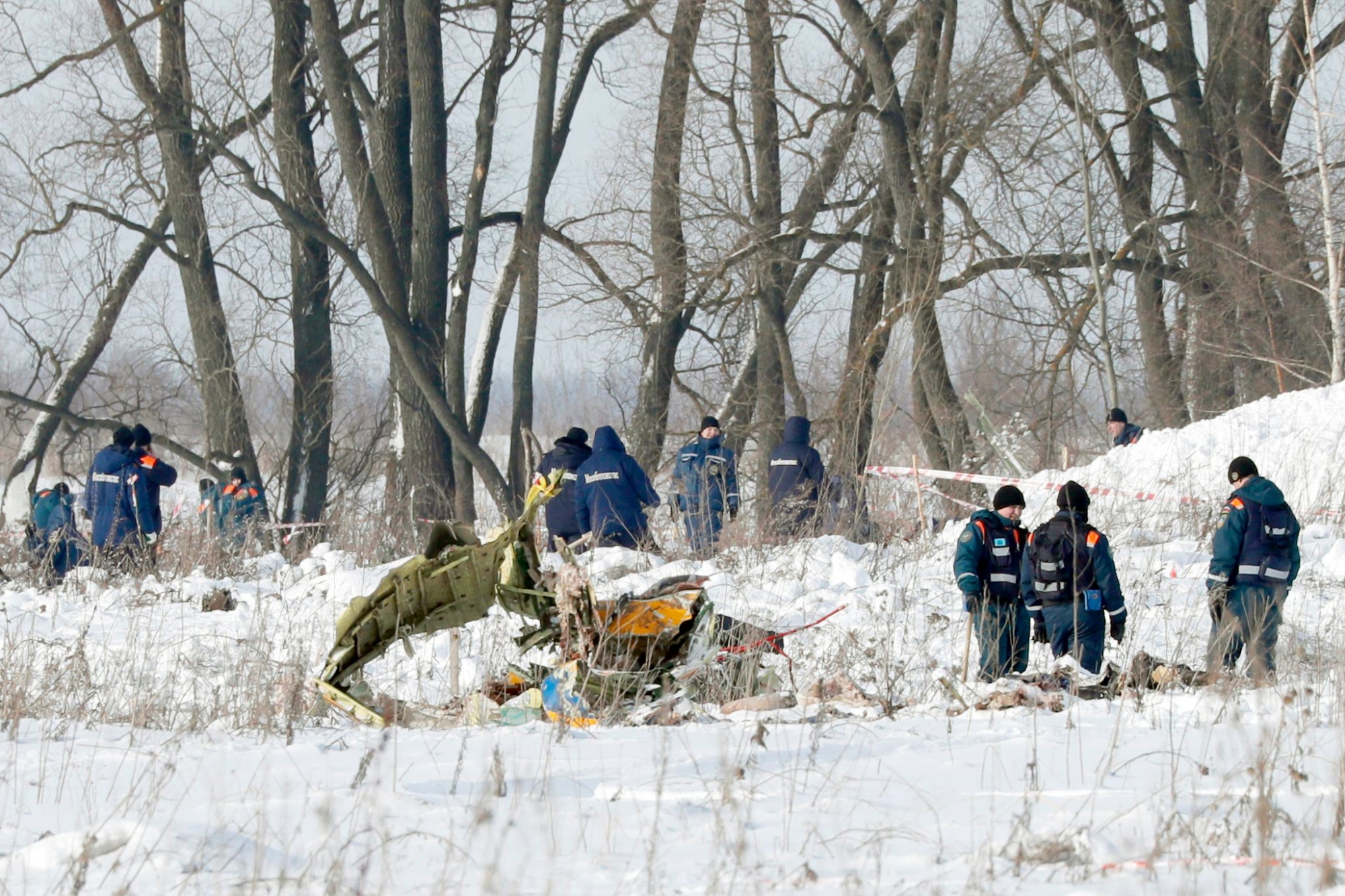 epa06517267 Russian rescuers search human remains and collect plane debris at the site of the crashed Russian Saratov Airlines Antonov AN-148 passenger plane near the Stepanovskoy village near Argunovo, Ramensky district, Moscow region, Russia, 11 February 2018. A Russian Antonov AN-148 crashed shortly after take off from Domodedovo airport outside Moscow. All 71 people aboard are believed to have died in the crash. The plane of Saratov airlines was en route from Moscow to Orsk, Orenburg region.  EPA/YURI KOCHETKOV RUSSIA PLANE CRASH