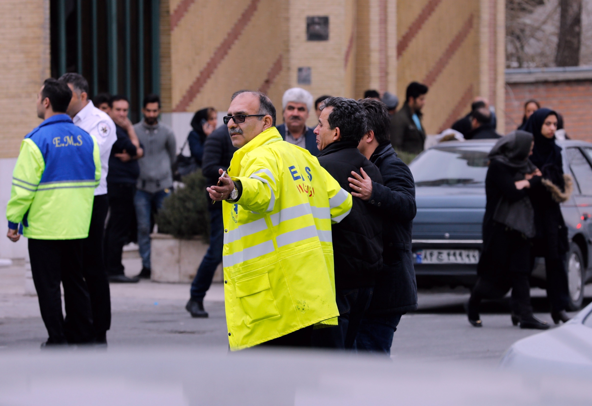 epa06539154 Iranian emergency helpers accompany relatives of passengers of an Iran Aseman Airline flight who are gathering around a mosque at the Mehr-Abad airport in Tehran, Iran, 18 February 2018. Media reported that a plane of Aseman Air crashed with around 60 passengers near Semirom, around the city of Isfahan. Reportedly all passengers are feared dead when the plane crashed in a mountainous region on its way from Tehran to Yassuj in South western Iran.  EPA/ABEDIN TAHERKENAREH IRAN PLANE CRASH REACTION