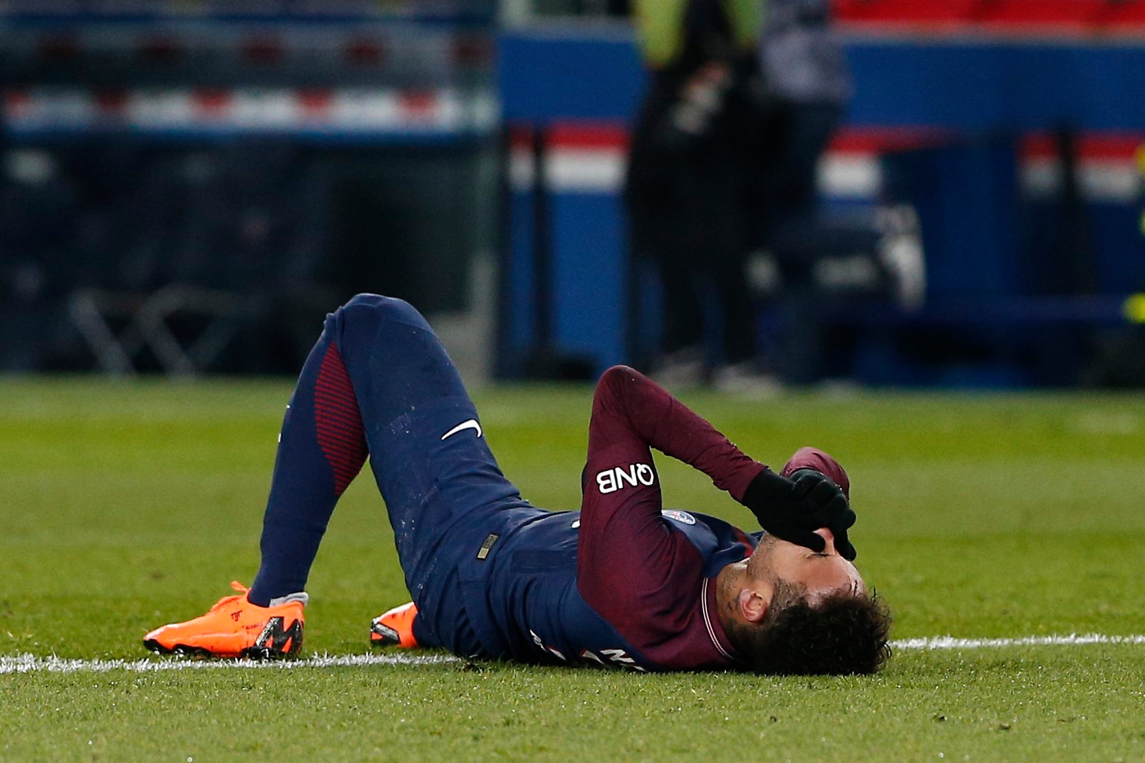 PSG's Neymar lays on the pitch after being fouled during the French League One soccer match between Paris Saint-Germain and Marseille at the Parc des Princes Stadium, in Paris, France, Sunday, Feb. 25, 2018. (AP Photo/Thibault Camus) FRANCE SOCCER LEAGUE ONE