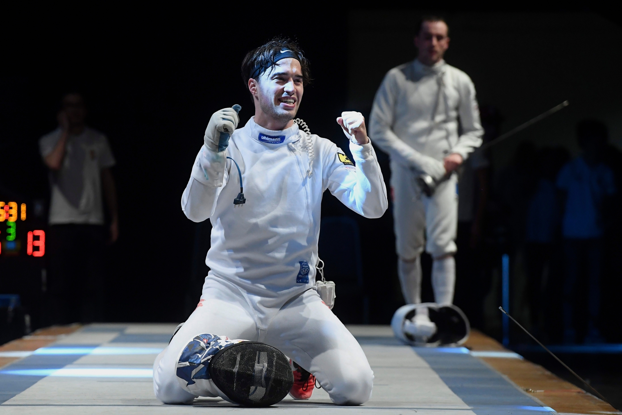 Max Heinzer of Switzerland celebrates his victory against Alex Fava of France at the end of the men's final round of the WestEnd Grand Prix of the Epee World Cup in MOM Sports Centre in Budapest, Hungary, Sunday, March 25, 2018. (Tamas Kovacs/MTI via AP) HUNGARY EPEE WORLD CUP