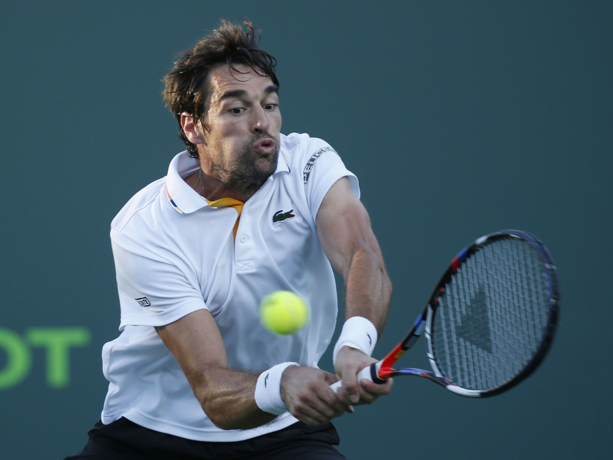 Jeremy Chardy, of France, returns a shot from Grigor Dimitrov, of Bulgaria, during a tennis match at the Miami Open, Sunday, March 25, 2018, in Key Biscayne, Fla. Chardy defeated Dimitrov 6-4, 6-4. (AP Photo/Wilfredo Lee)