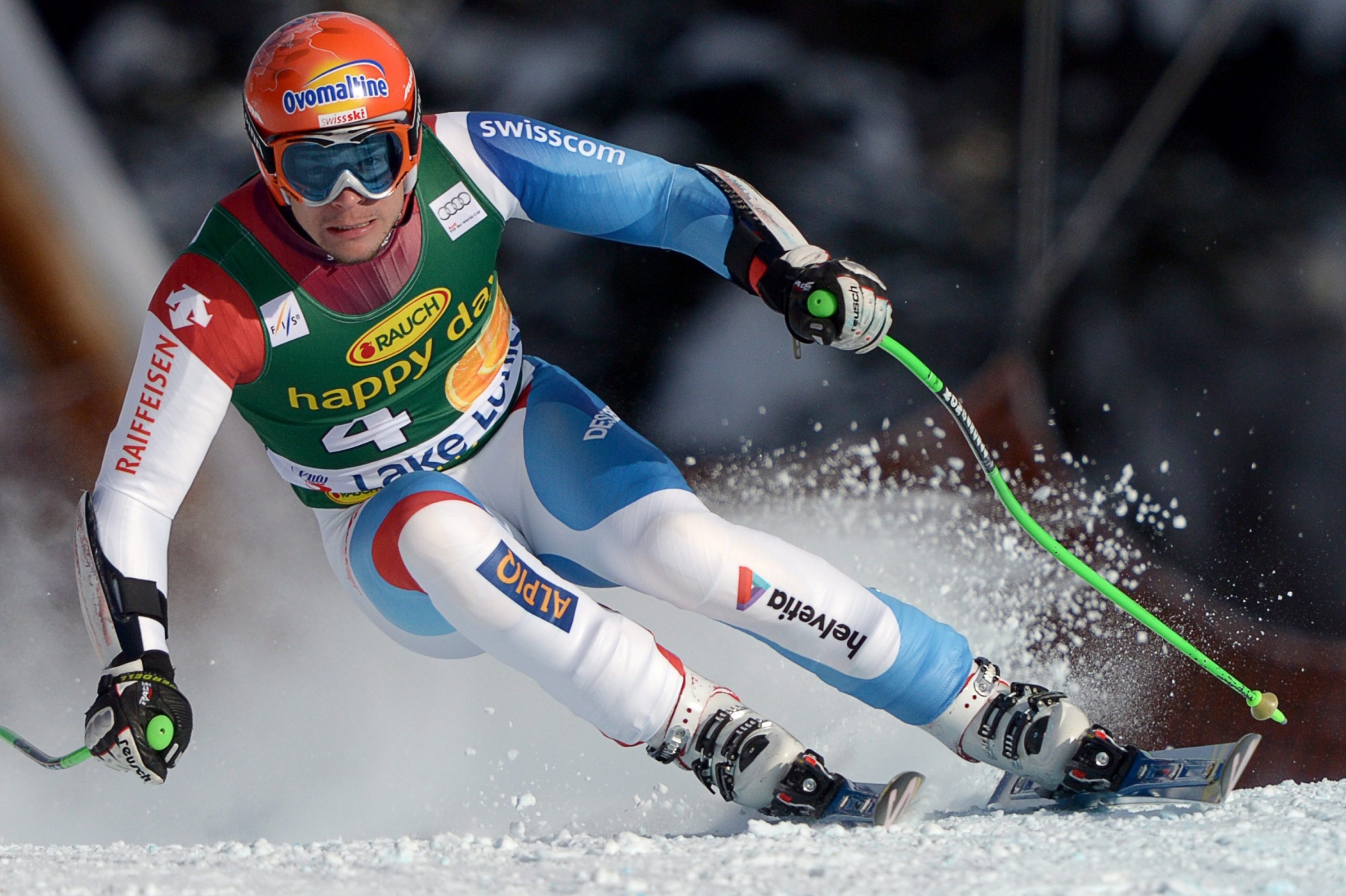 Patrick Kueng, of Switzerland, speeds down the hill during the men's Super-G race at the Lake Louise Winterstart World Cup in Lake Louise, Alberta, Sunday, Nov. 25, 2012. (AP Photo/THE CANADIAN PRESS,Jonathan Hayward)