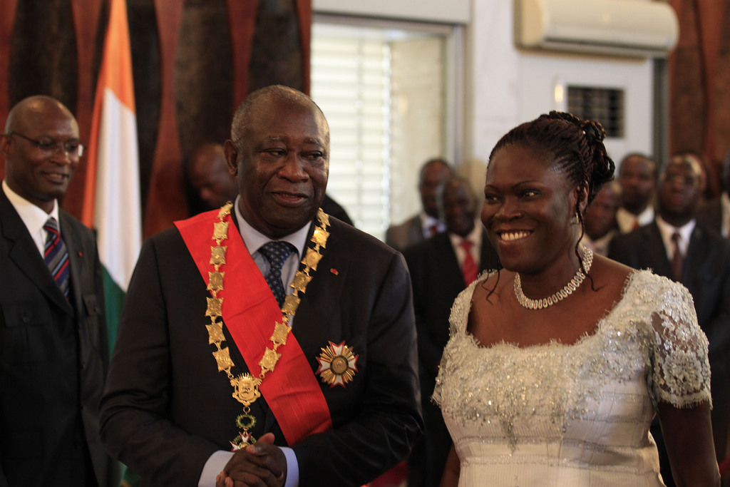 Ivory Coast incumbent President Laurent Gbagbo stands with his wife Simone during his swearing-in ceremony at the Presidential Palace in Abidjan, Ivory Coast, Saturday, Dec. 4, 2010. The two candidates in Ivory Coast's  disputed presidential election took dueling oaths of office Saturday after each claimed victory, as the political crisis spiraled out of control and renewed unrest in this country once split in two by civil war.(AP Photo/Rebecca Blackwell)